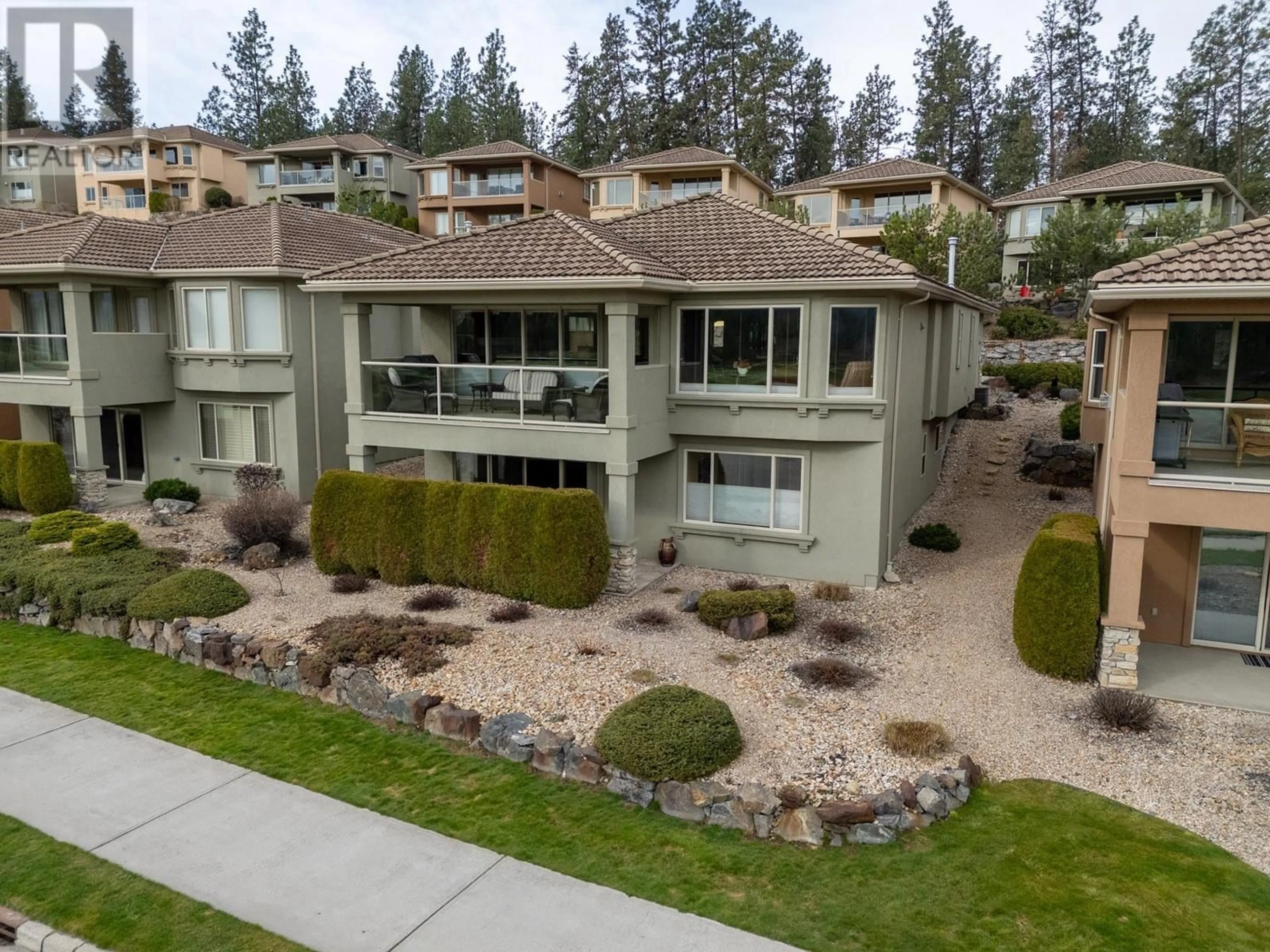 A pic from outside/outdoor area/front of a property/back of a property/a pic from drone, unknown for 111 - 2455 QUAIL RIDGE BOULEVARD, Kelowna British Columbia V1V2S8