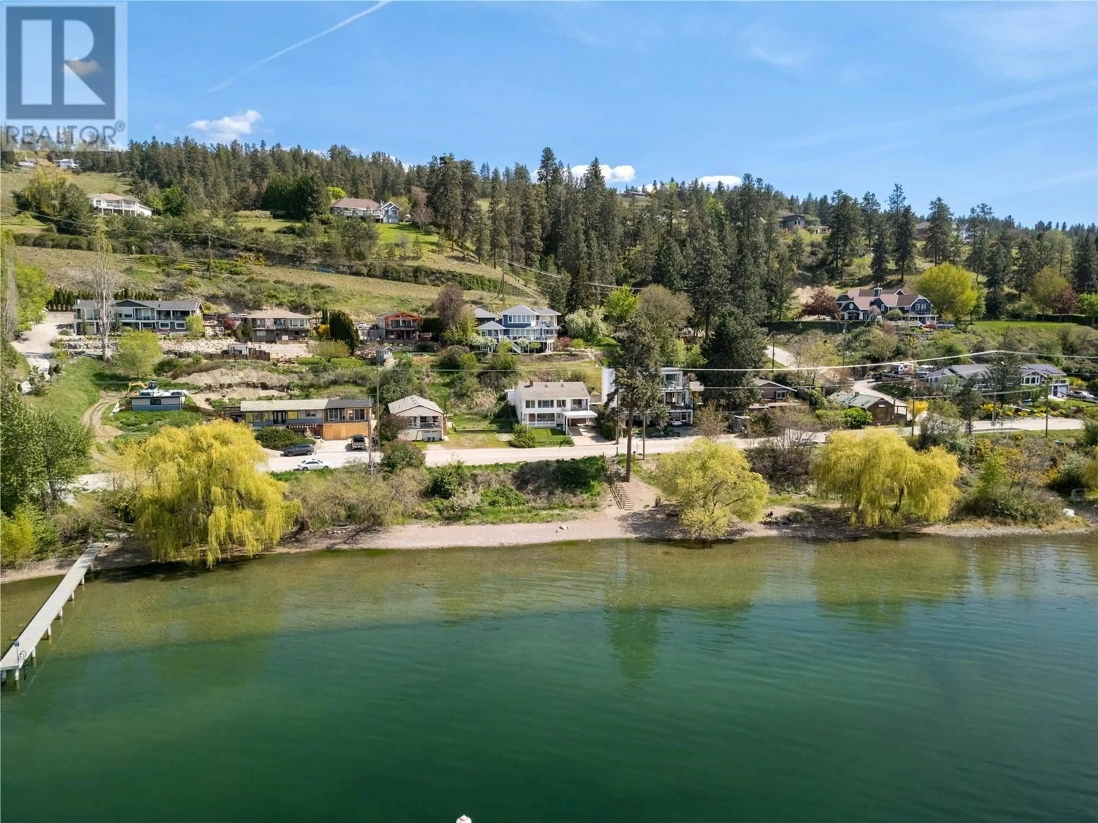 A pic from outside/outdoor area/front of a property/back of a property/a pic from drone, water/lake/river/ocean view for 11551 OKANAGAN CENTRE ROAD WEST, Lake Country British Columbia V4V2H2