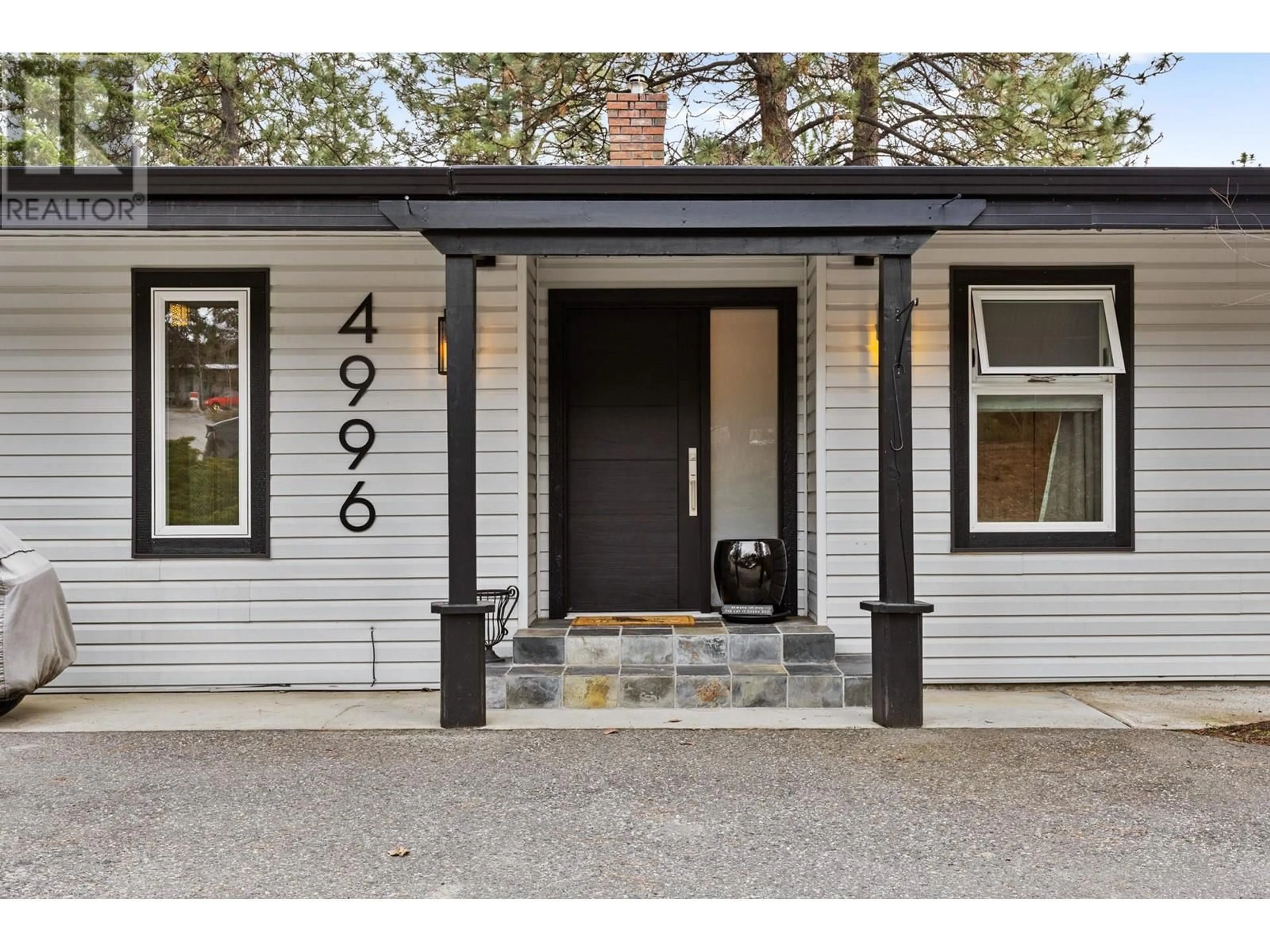 Home with vinyl exterior material, street for 4996 BRADLEY DRIVE, Peachland British Columbia V0H1X8