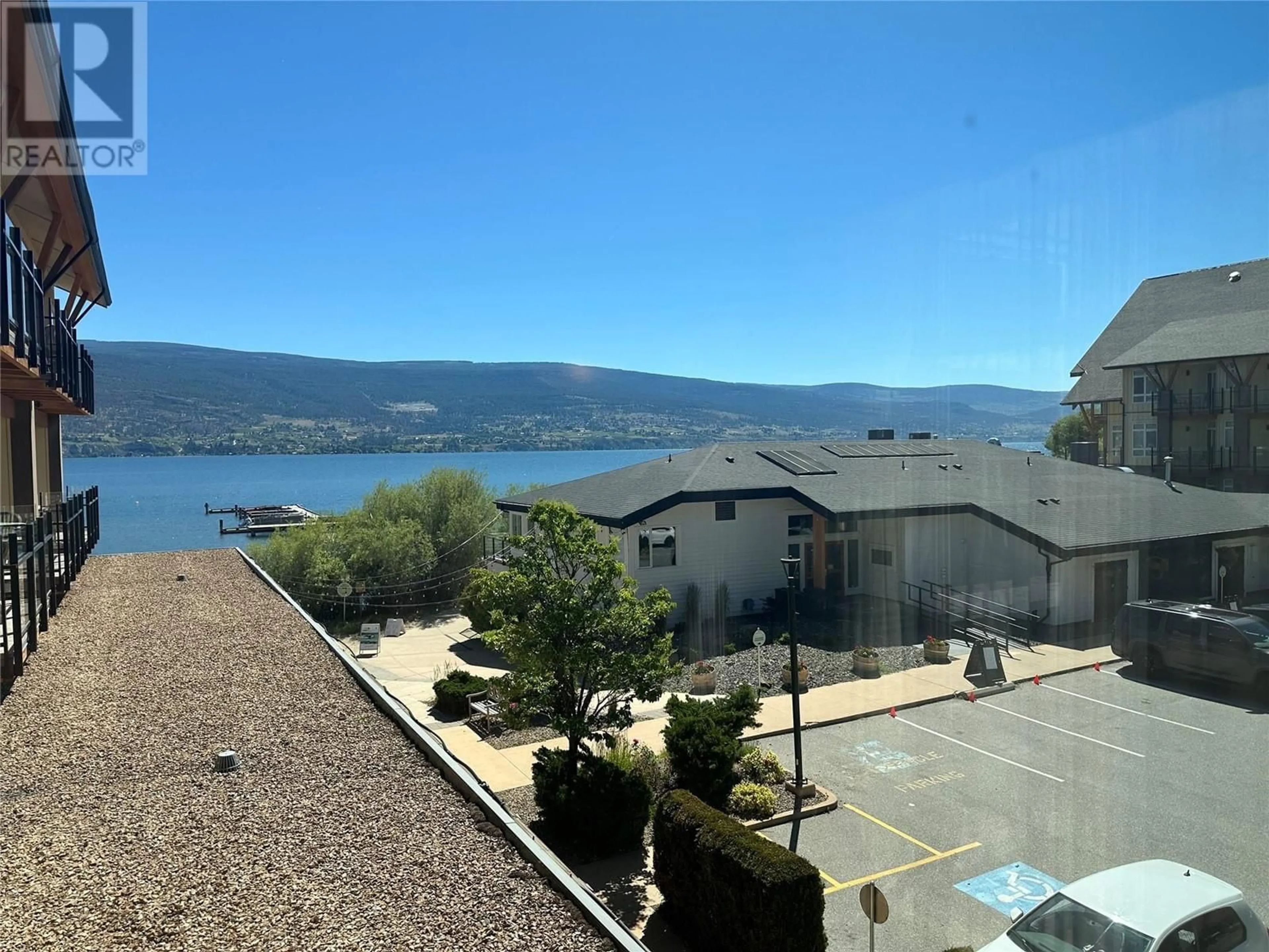 A pic from outside/outdoor area/front of a property/back of a property/a pic from drone, water/lake/river/ocean view for 231 - 13011 LAKESHORE DRIVE, Summerland British Columbia V0H1Z1