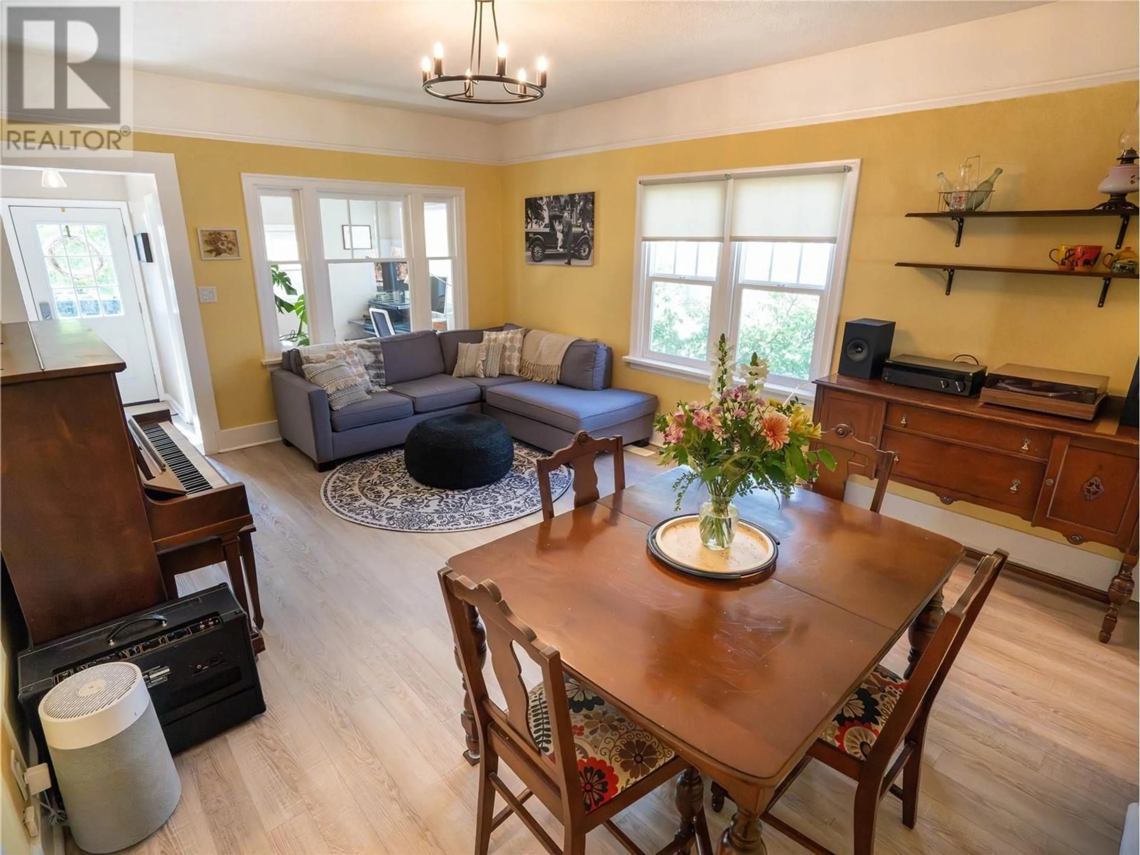Living room with furniture, wood/laminate floor for 540 PAPINEAU STREET, Penticton British Columbia V2A4X5