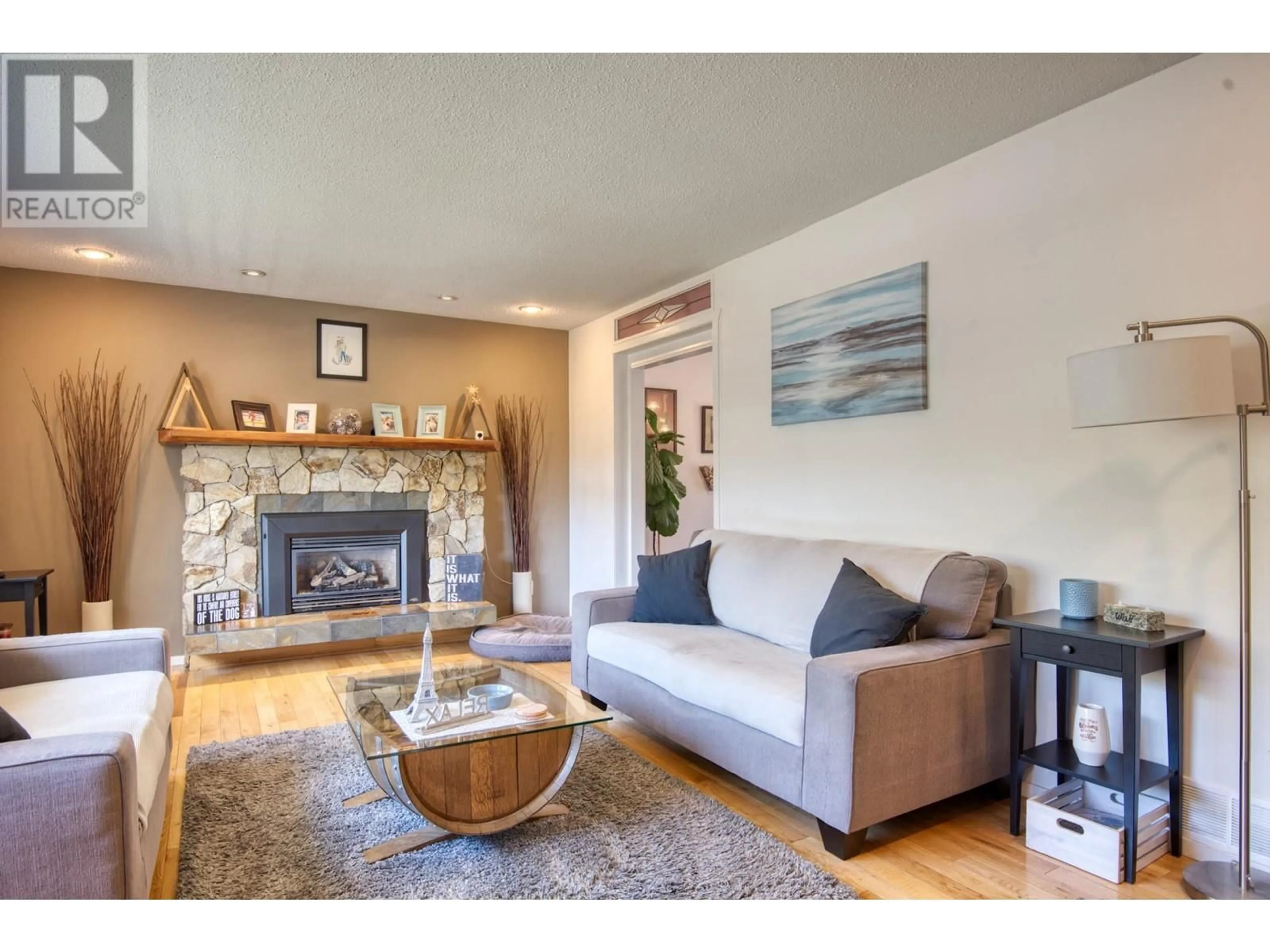 Living room with furniture, wood/laminate floor for 1750 RIDGEDALE AVENUE, Penticton British Columbia V2A2S6