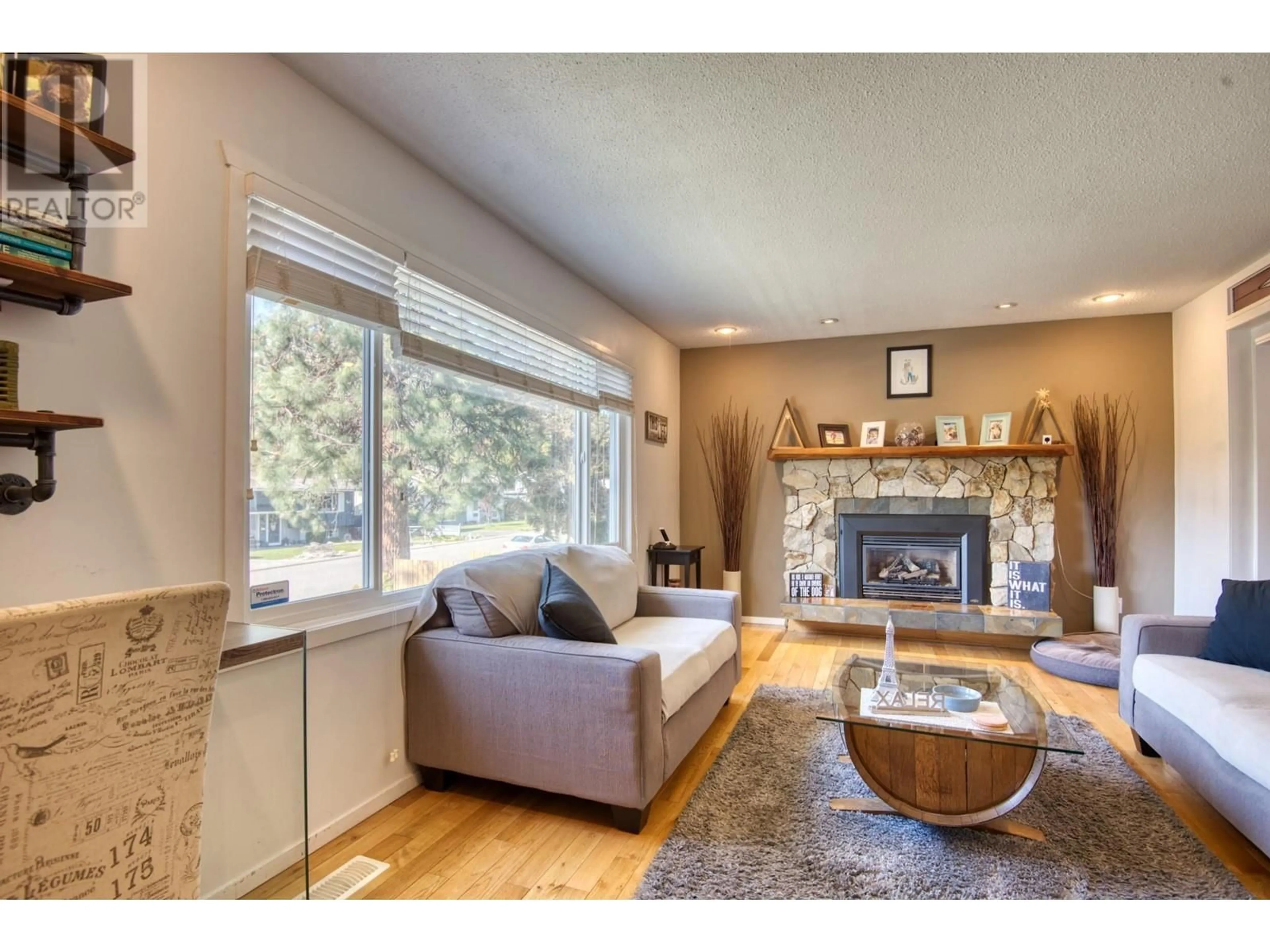 Living room with furniture, wood/laminate floor for 1750 RIDGEDALE AVENUE, Penticton British Columbia V2A2S6