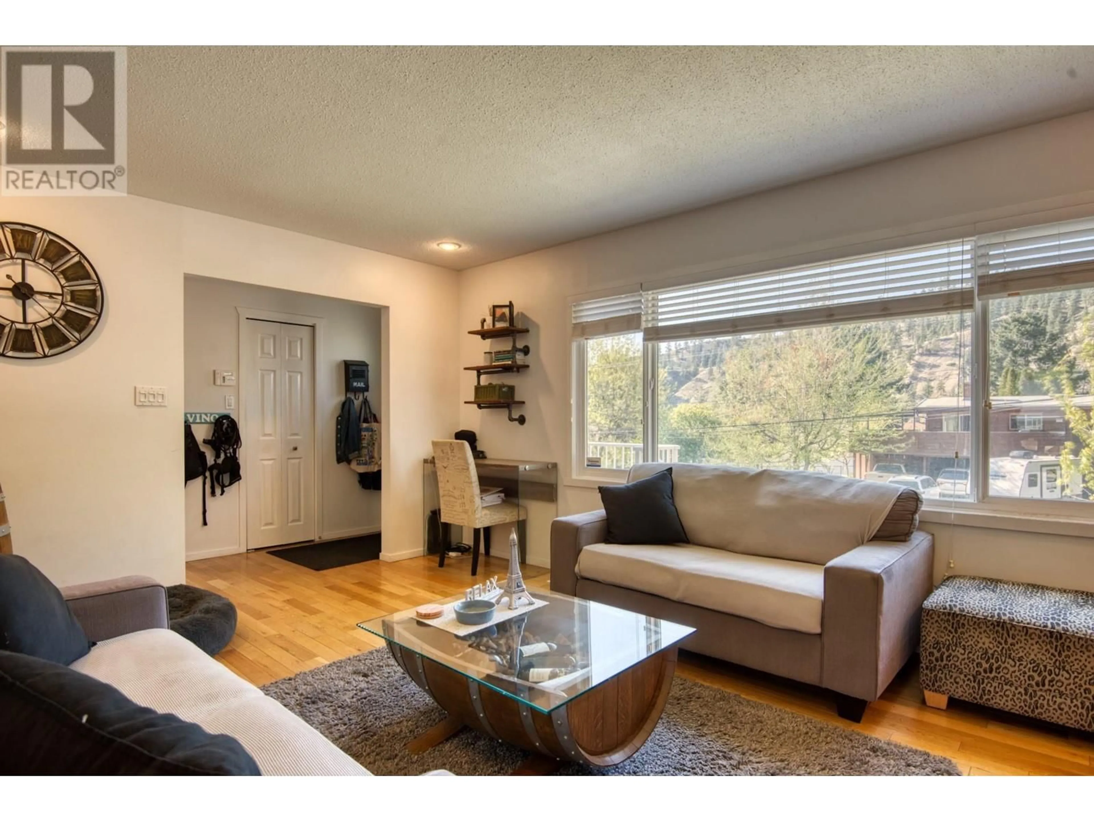 Living room with furniture, wood/laminate floor for 1750 RIDGEDALE AVENUE, Penticton British Columbia V2A2S6