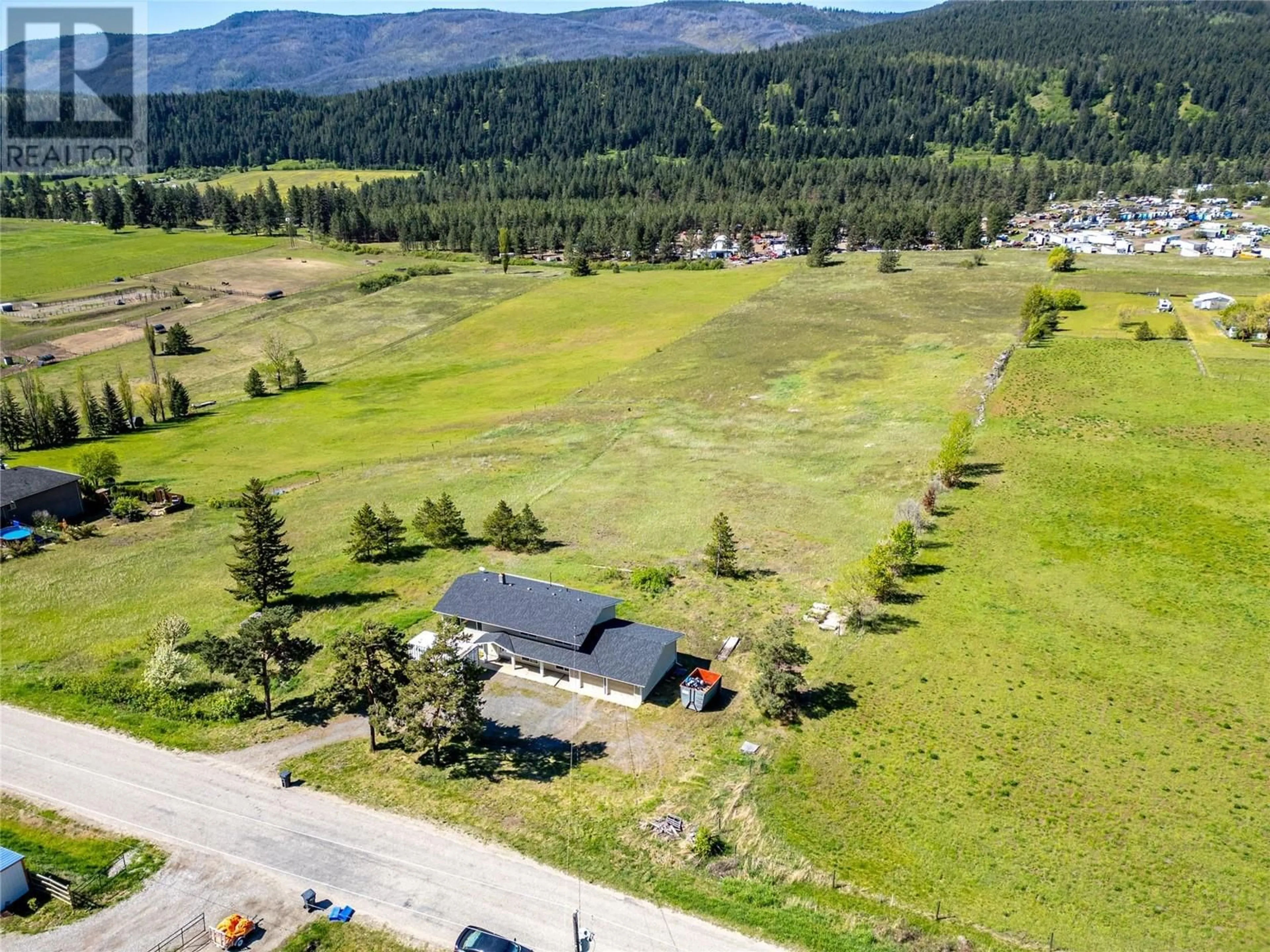 A pic from outside/outdoor area/front of a property/back of a property/a pic from drone, mountain view for 1278 ROUND LAKE ROAD, Armstrong British Columbia V0E1B5