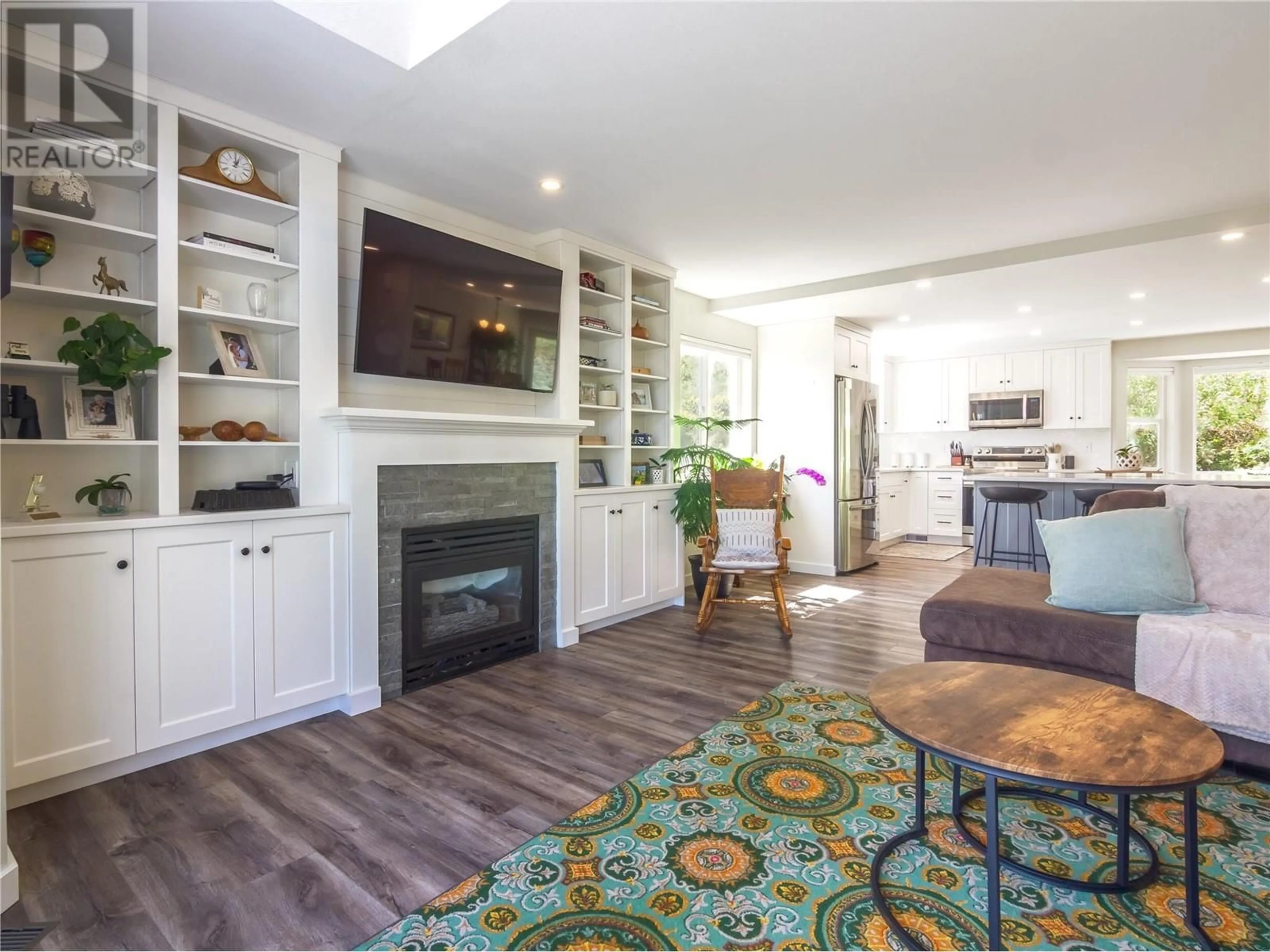 Living room with furniture, wood/laminate floor for 107 UPLANDS DRIVE, Kaleden British Columbia V0H1K0