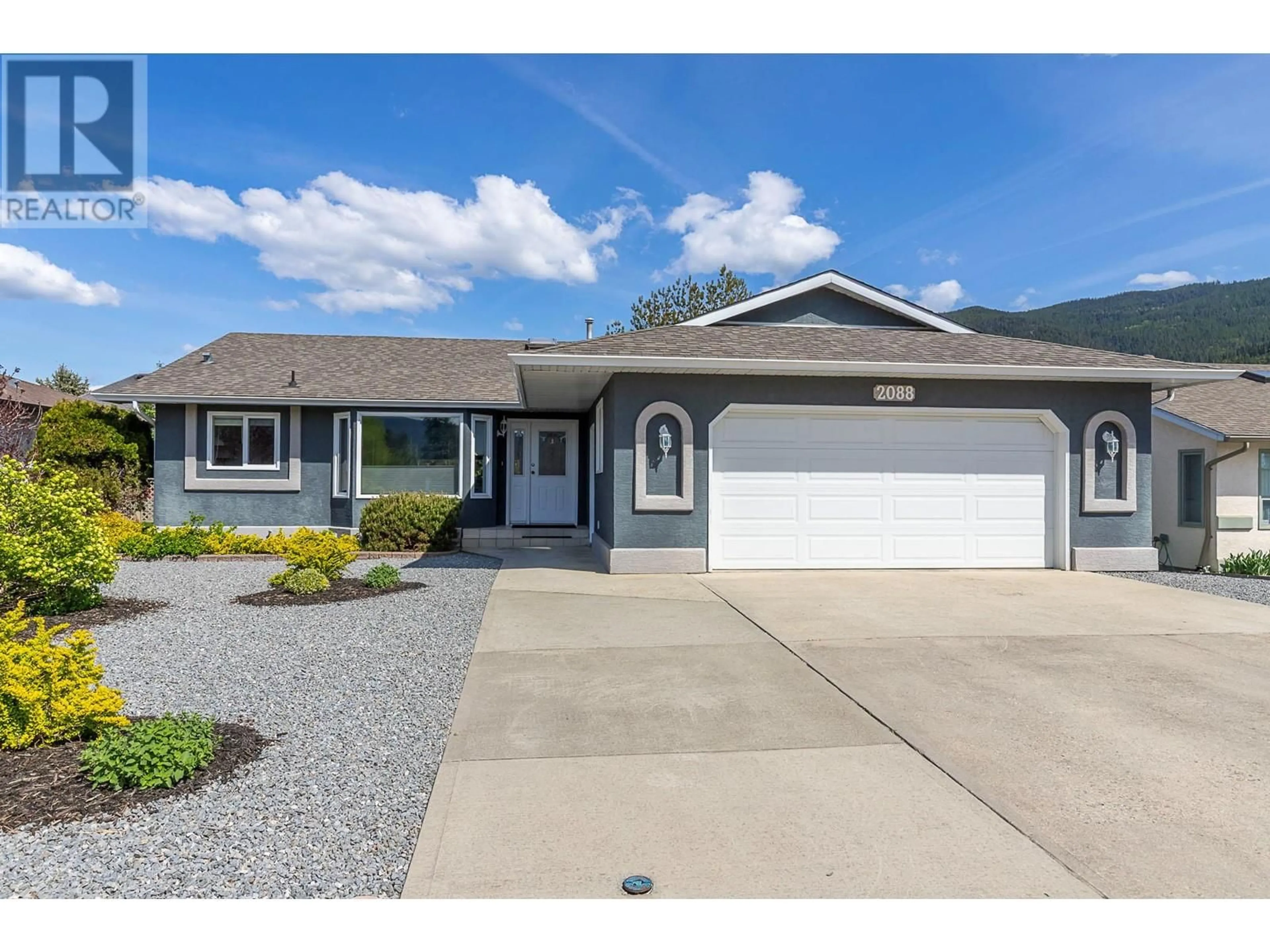 Home with vinyl exterior material, street for 2088 OKANAGAN STREET, Armstrong British Columbia V4Y0C4