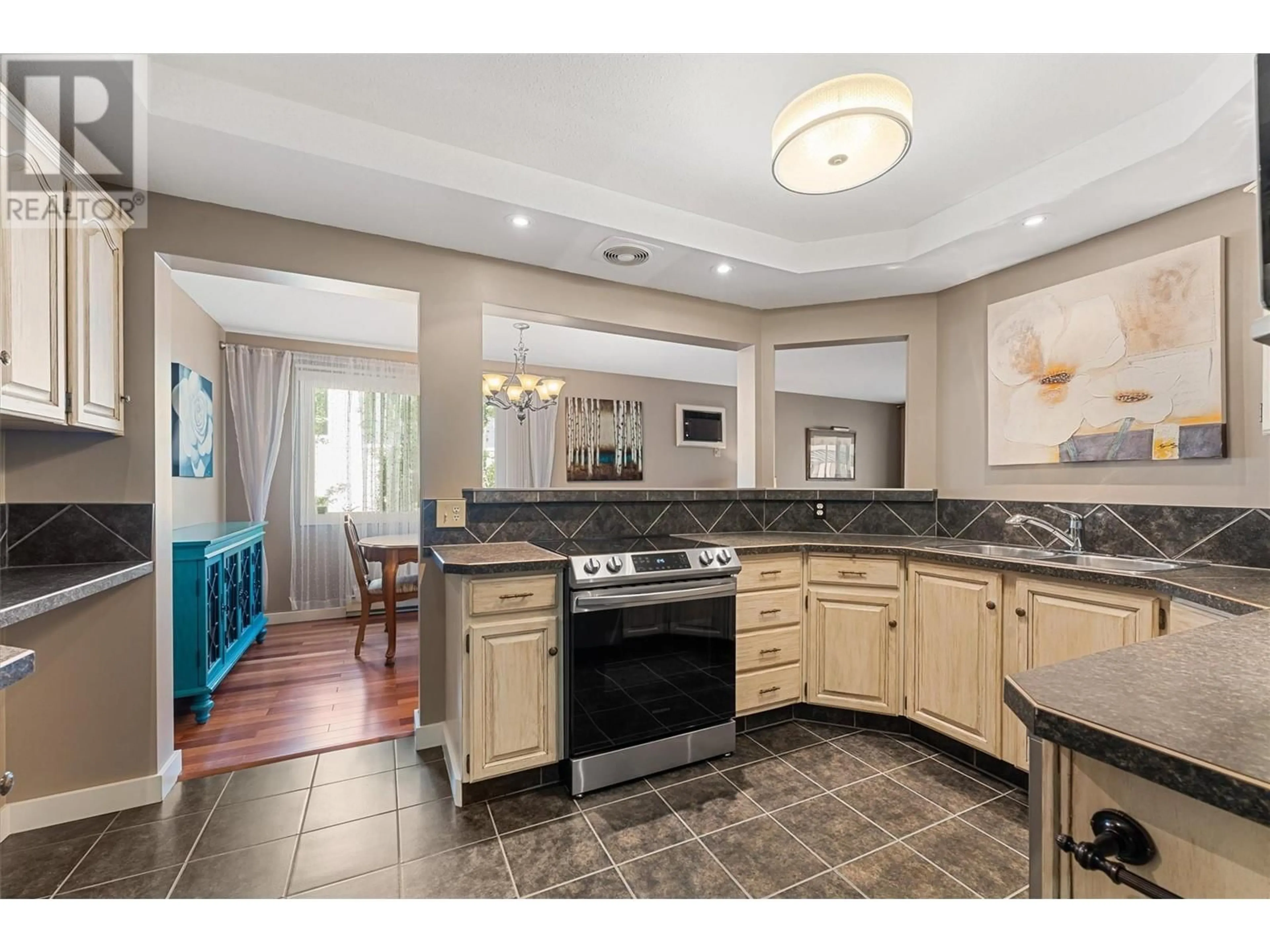 Open concept kitchen, ceramic/tile floor for 107 - 1170 BROOKSIDE AVENUE, Kelowna British Columbia V1Y5T4