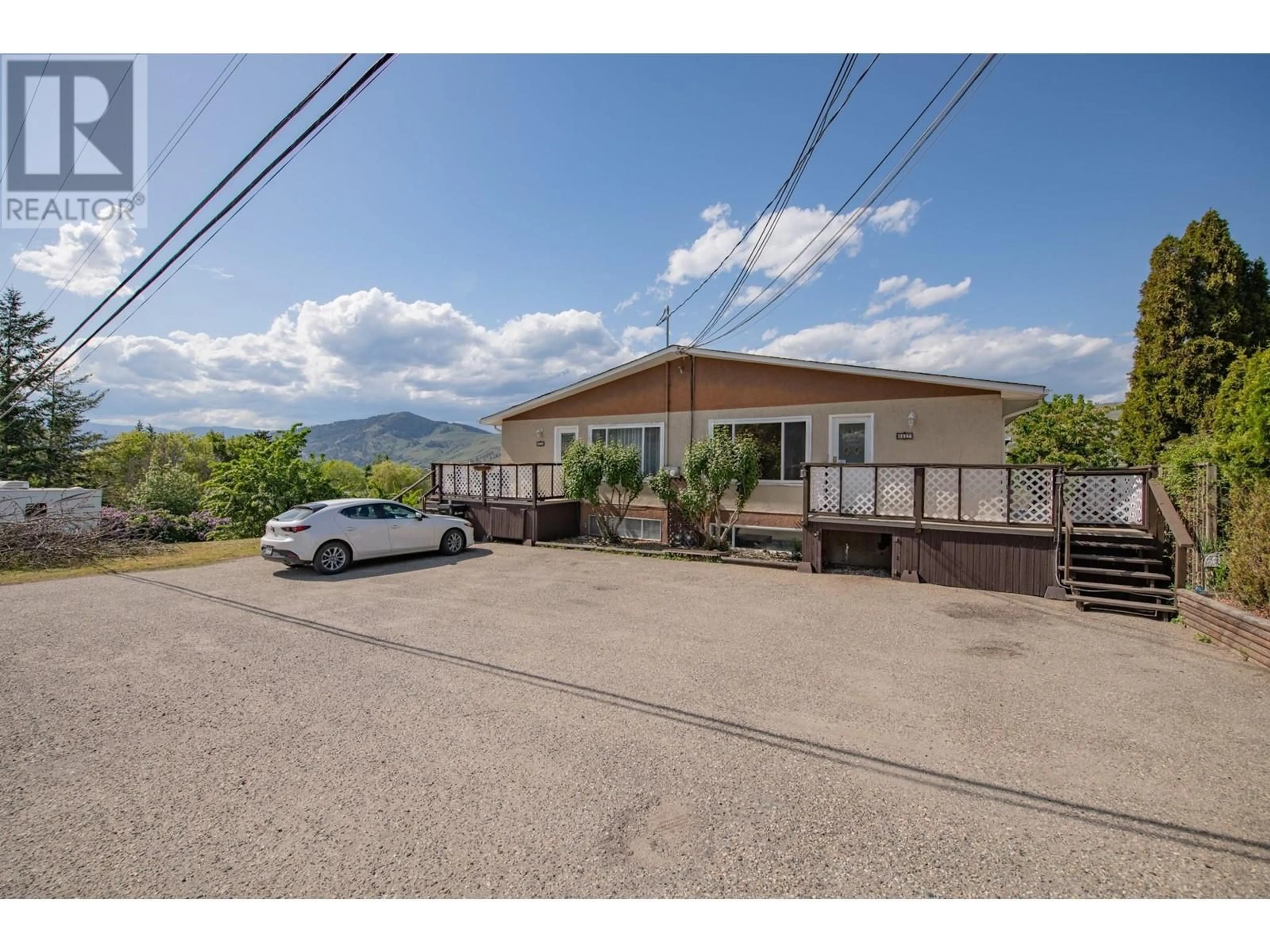 A pic from outside/outdoor area/front of a property/back of a property/a pic from drone, mountain view for 6627 LONGACRE DRIVE, Vernon British Columbia V1H1H9