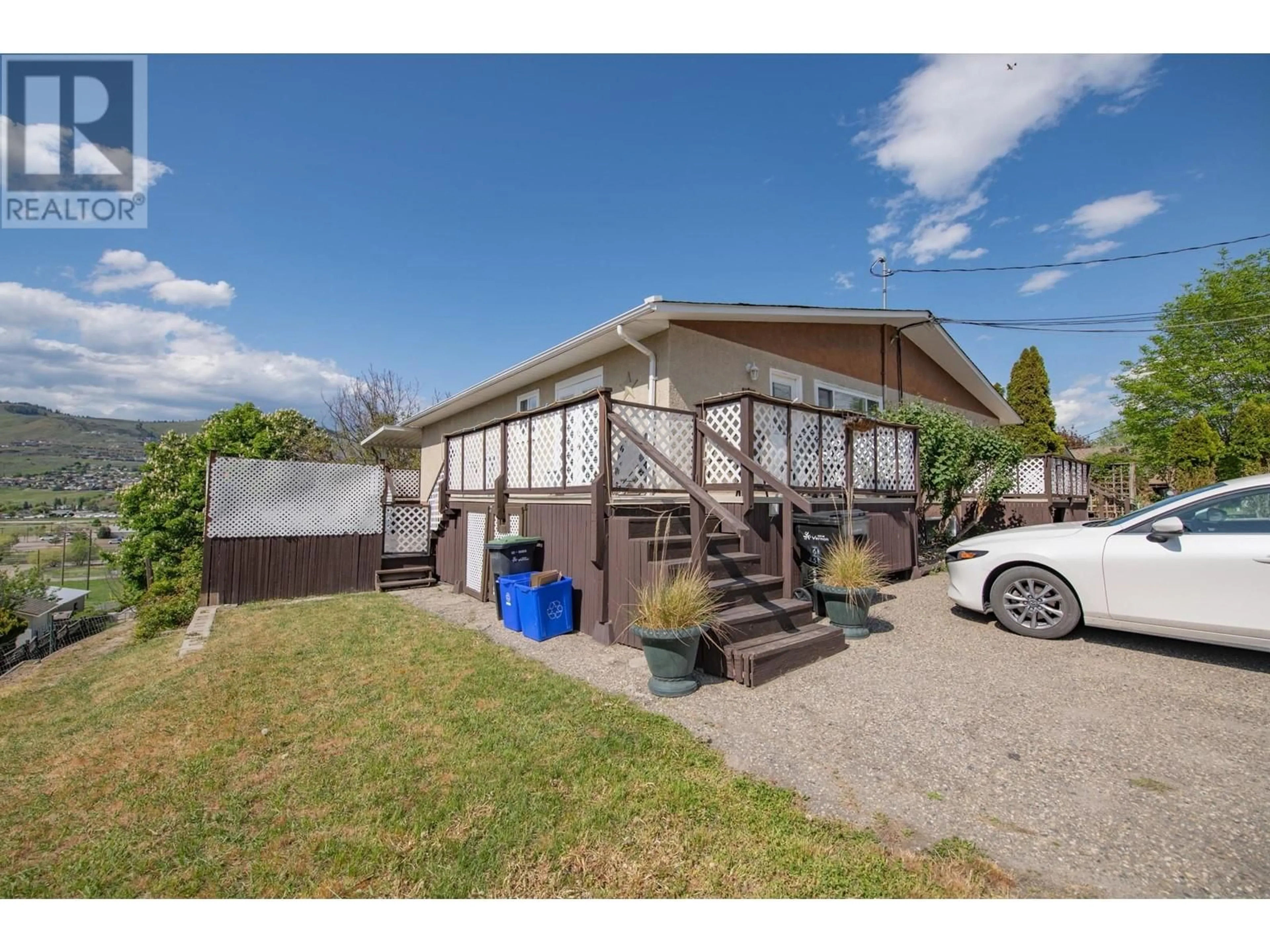 A pic from outside/outdoor area/front of a property/back of a property/a pic from drone, street for 6627 LONGACRE DRIVE, Vernon British Columbia V1H1H9