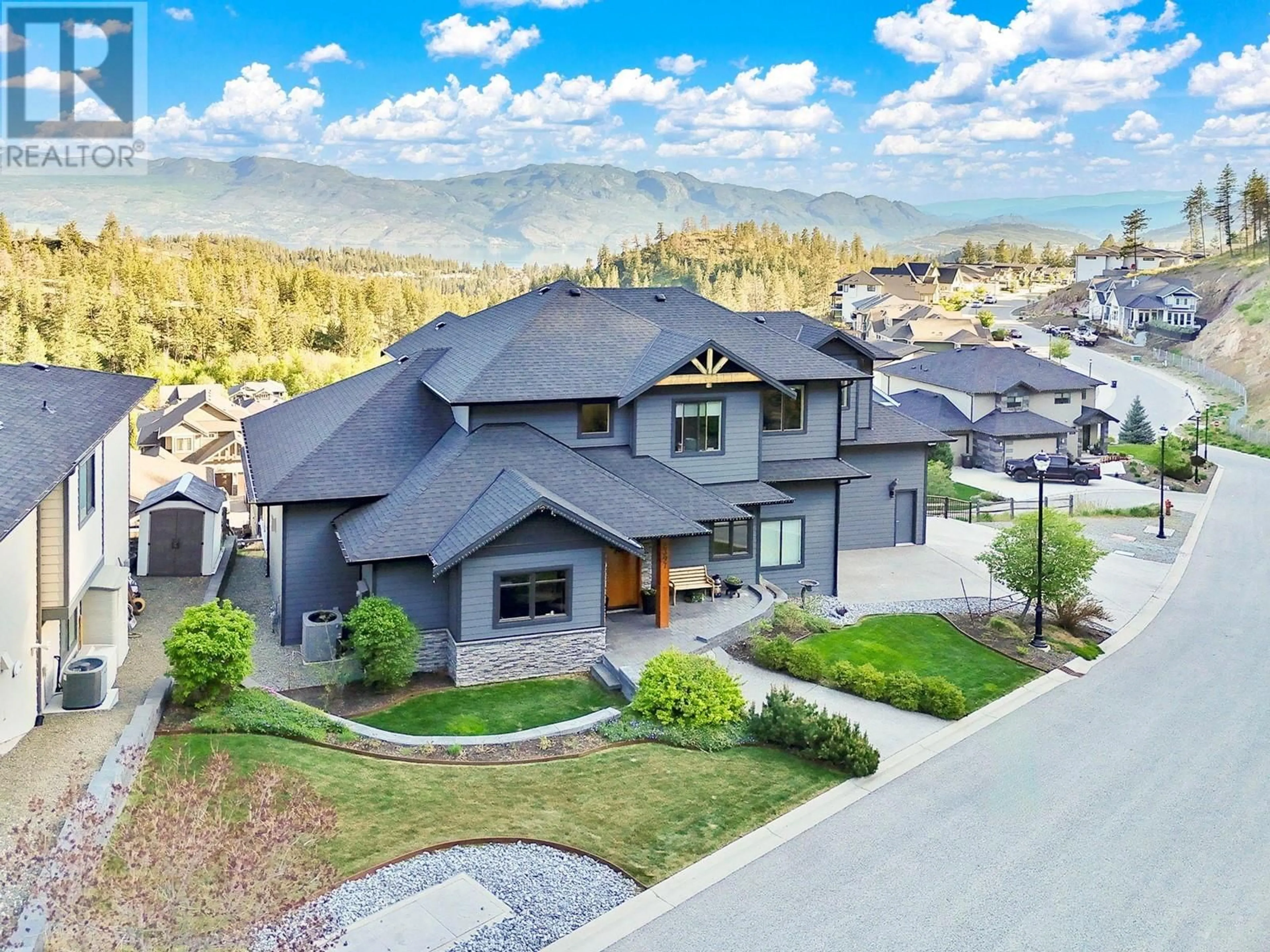 A pic from outside/outdoor area/front of a property/back of a property/a pic from drone, mountain view for 2397 BIG SKY DRIVE, West Kelowna British Columbia V4T3M2