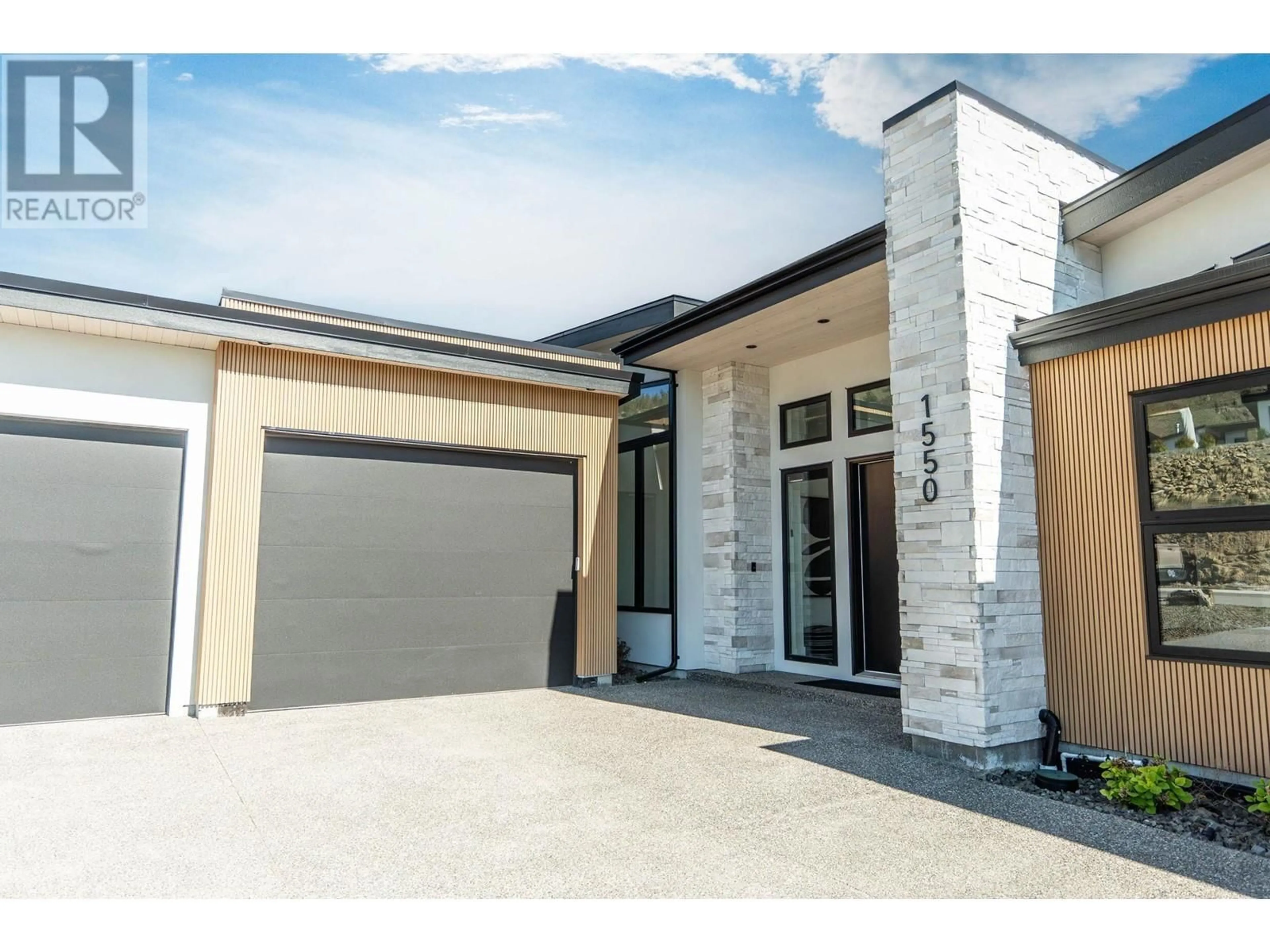 Home with brick exterior material, street for 1550 VIOGNIER DRIVE, West Kelowna British Columbia V4T3B5