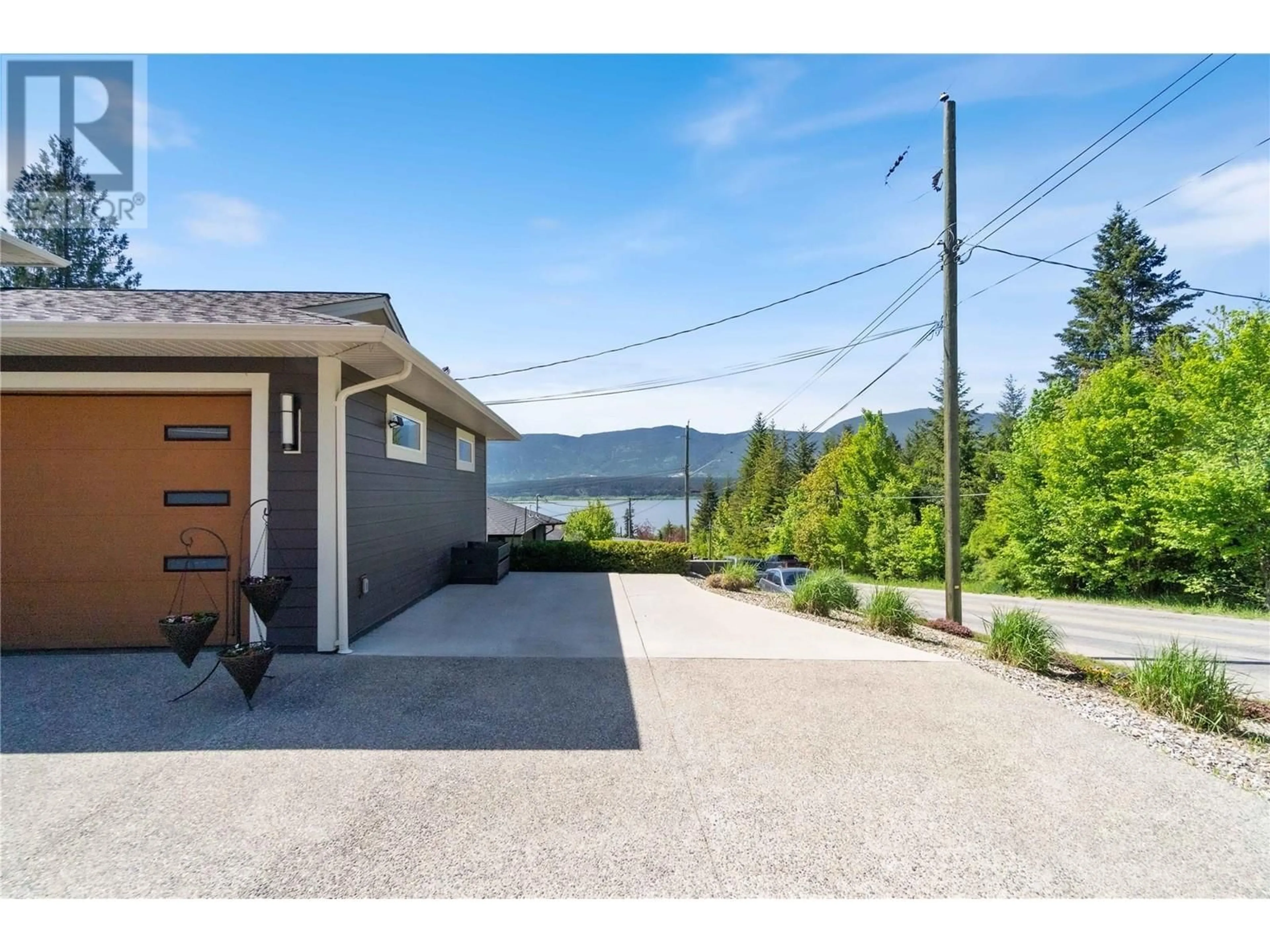 A pic from outside/outdoor area/front of a property/back of a property/a pic from drone, water/lake/river/ocean view for 1750 20 AVENUE NORTHEAST, Salmon Arm British Columbia V1E2G3