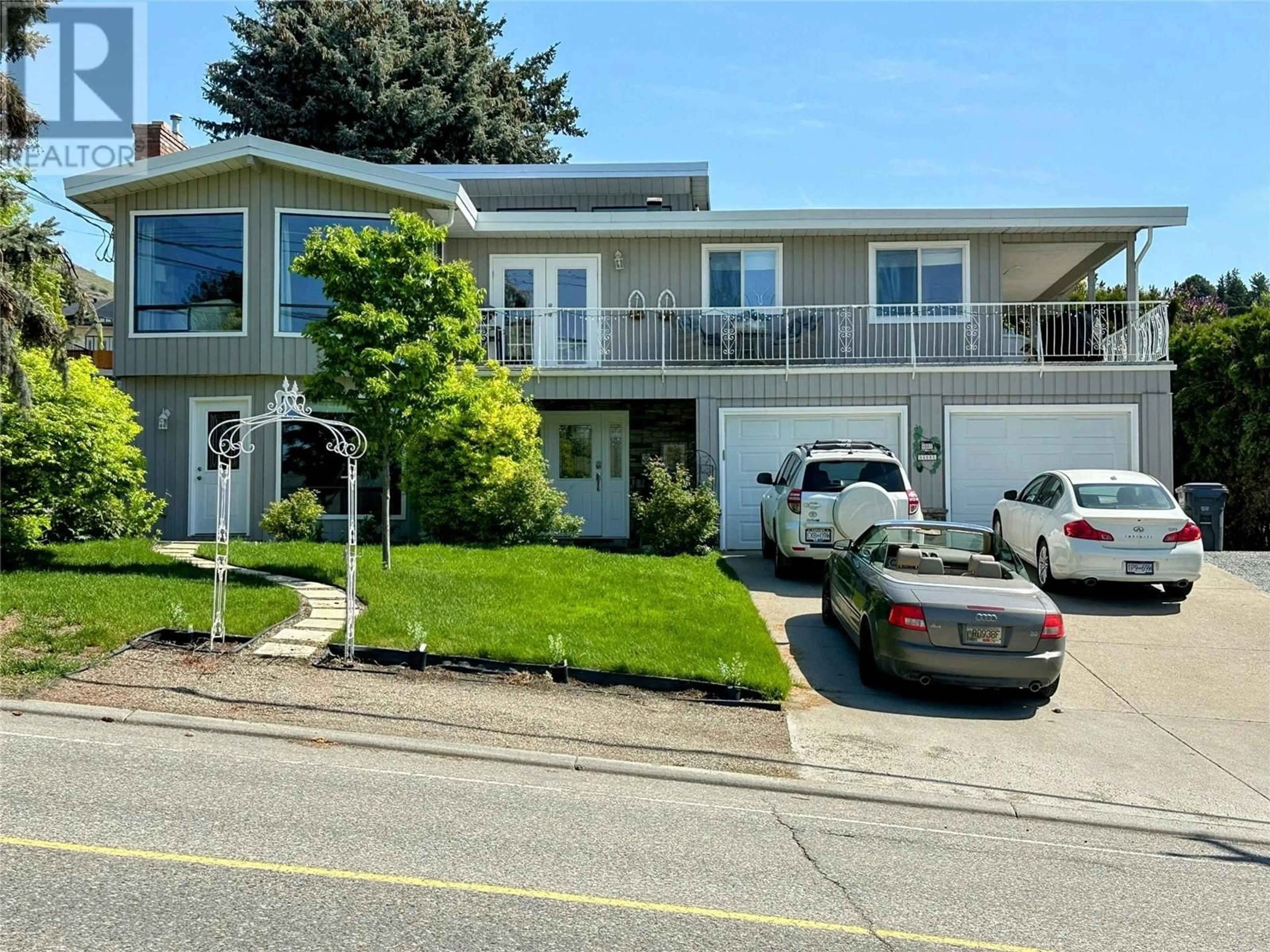 Home with vinyl exterior material, street for 9001 HUSBAND ROAD, Coldstream British Columbia V1B1M8