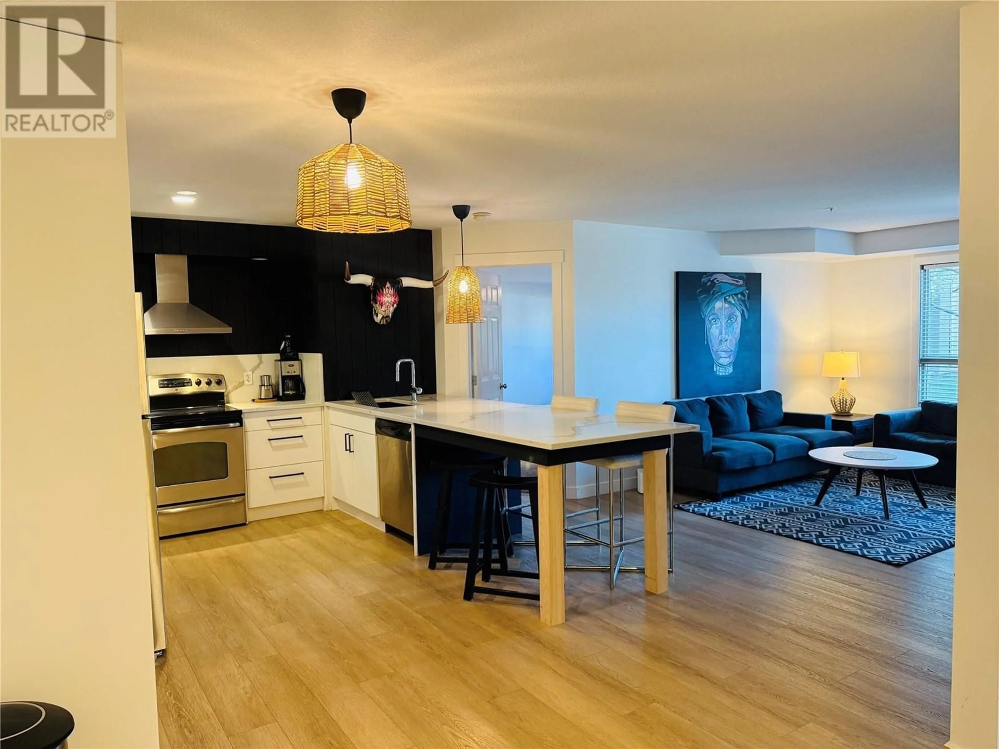 Open concept kitchen, wood/laminate floor for 2102 - 205 THIRD AVENUE, Invermere British Columbia V0A1K0