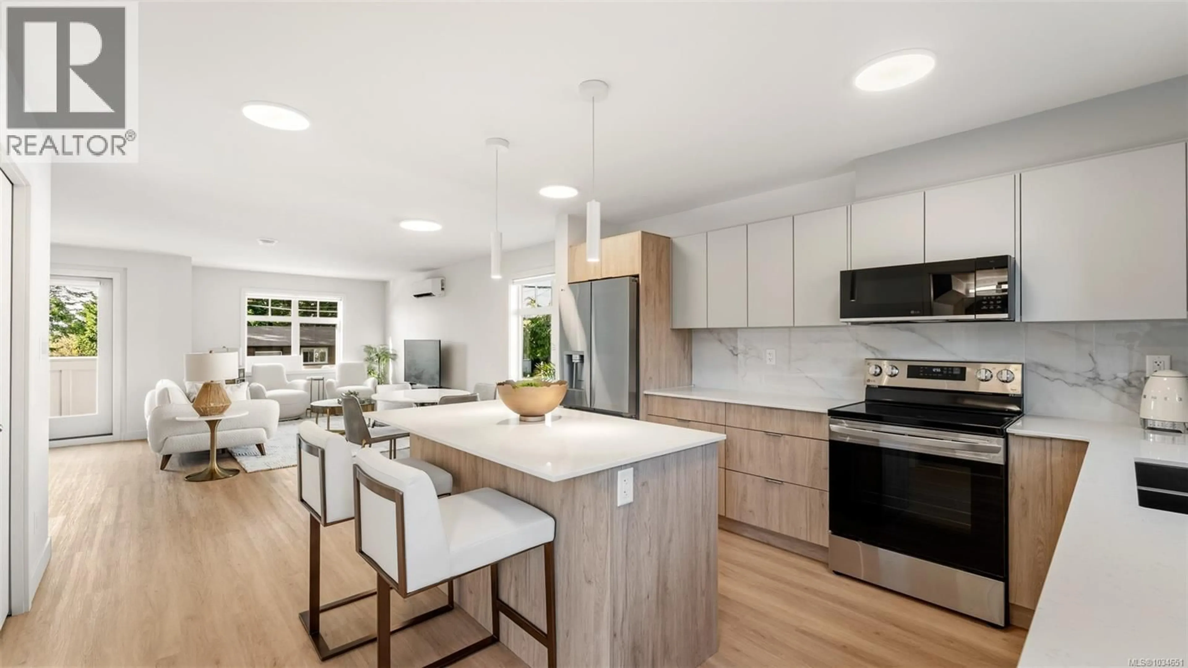 Open concept kitchen, wood/laminate floor for 4201 - 4201 TYNDALL AVENUE, Saanich British Columbia V8N0C4