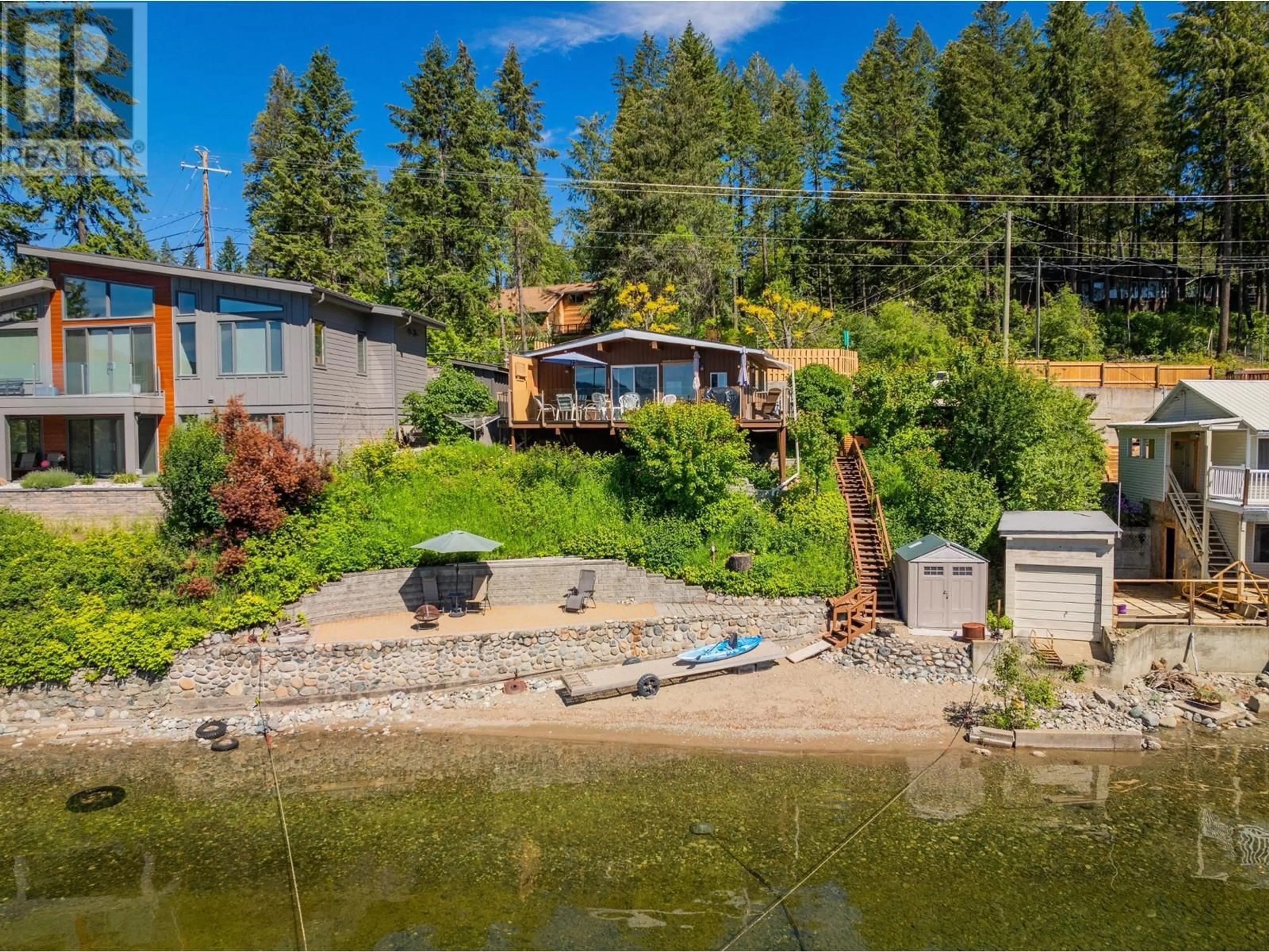 A pic from outside/outdoor area/front of a property/back of a property/a pic from drone, water/lake/river/ocean view for 93 EAST LAKE DRIVE, Christina Lake British Columbia V0H1E1