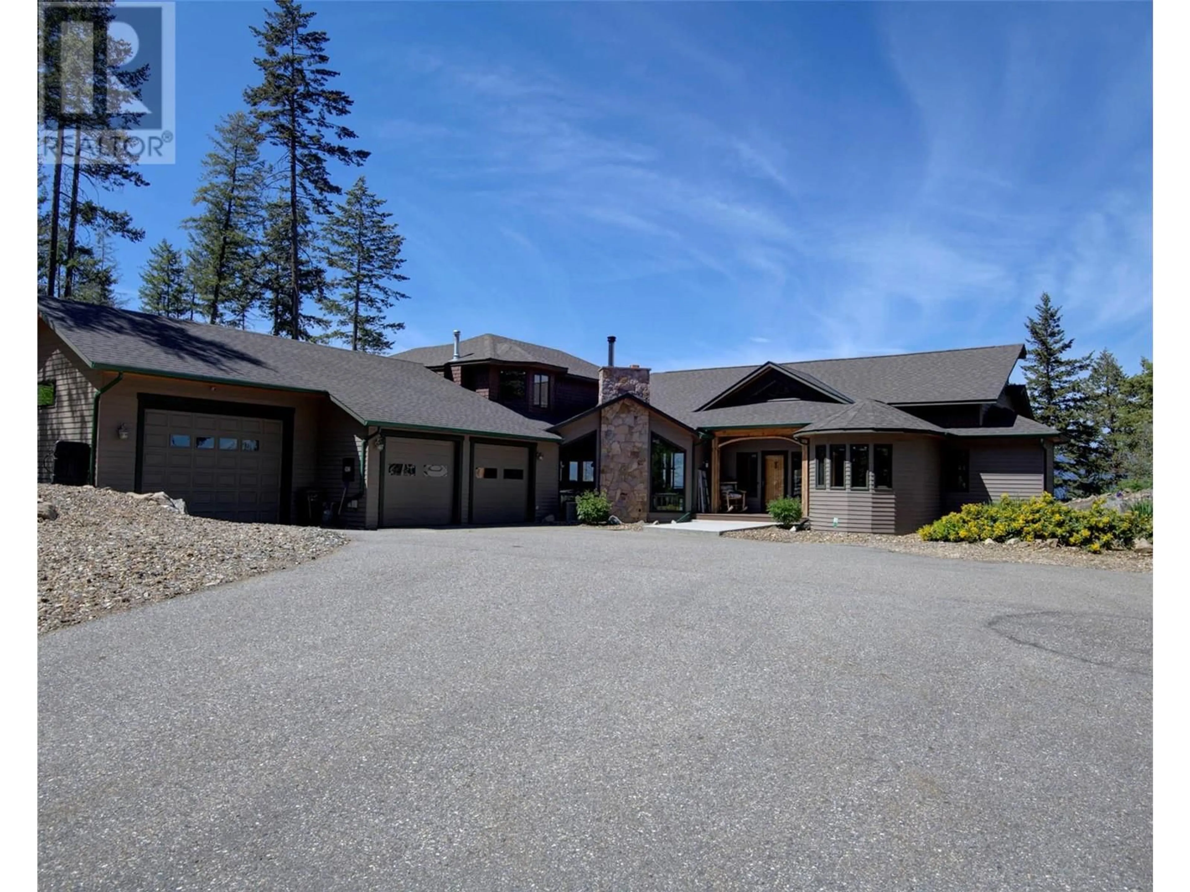 A pic from outside/outdoor area/front of a property/back of a property/a pic from drone, street for 9260 CHINOOK ROAD, Vernon British Columbia V1H1K3