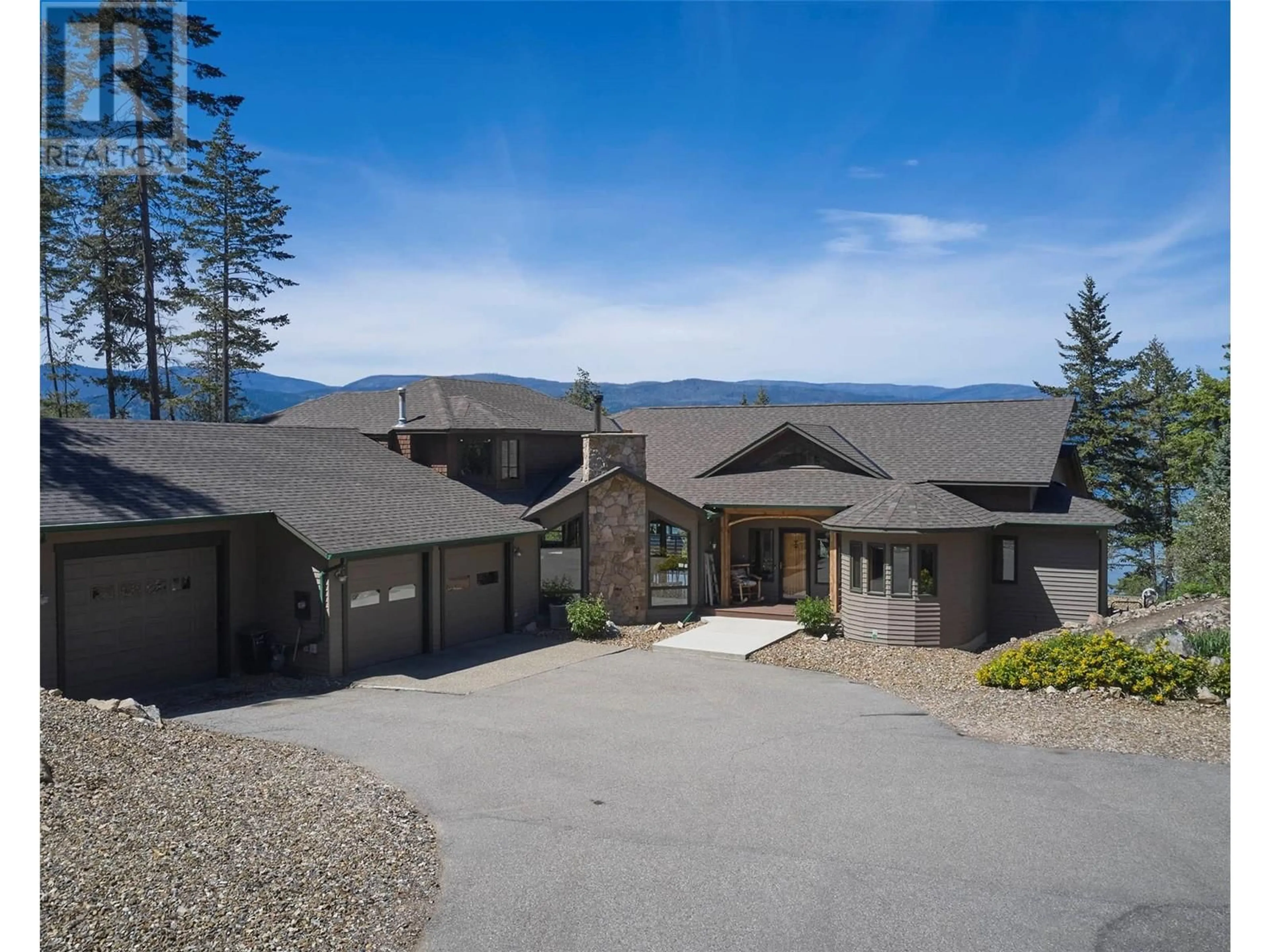 A pic from outside/outdoor area/front of a property/back of a property/a pic from drone, mountain view for 9260 CHINOOK ROAD, Vernon British Columbia V1H1K3