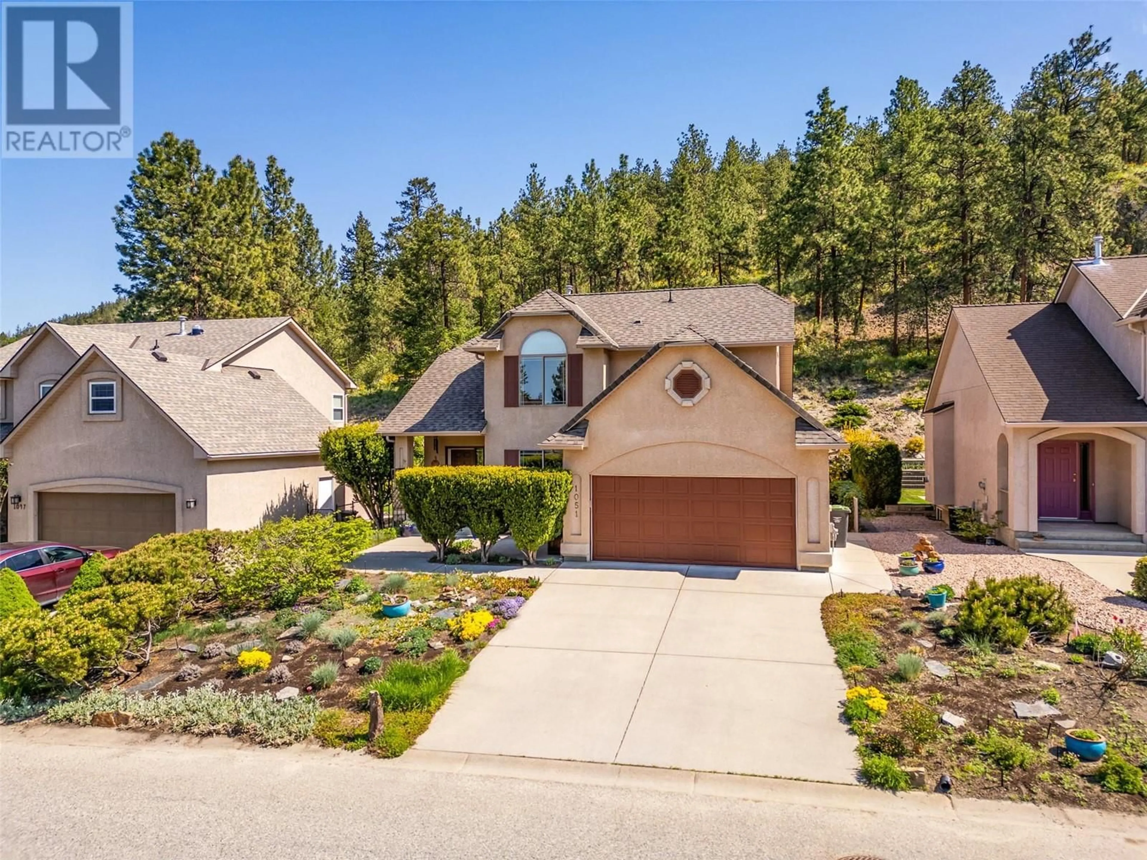 A pic from outside/outdoor area/front of a property/back of a property/a pic from drone, unknown for 1051 CHILCOTIN CRESCENT, Kelowna British Columbia V1V2L7