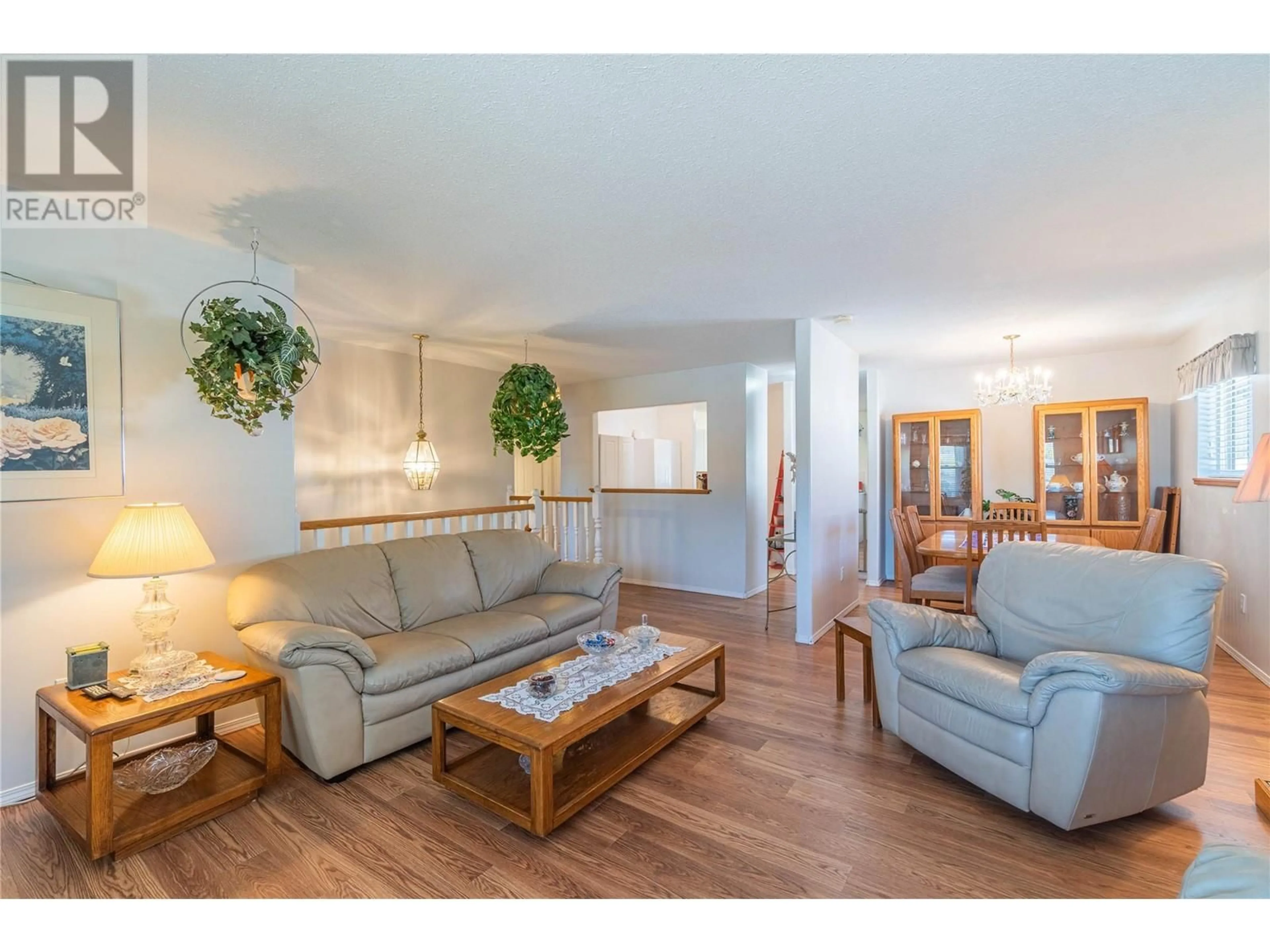 Living room with furniture, wood/laminate floor for 2044 MONTEITH DRIVE, Kamloops British Columbia V2E2G5