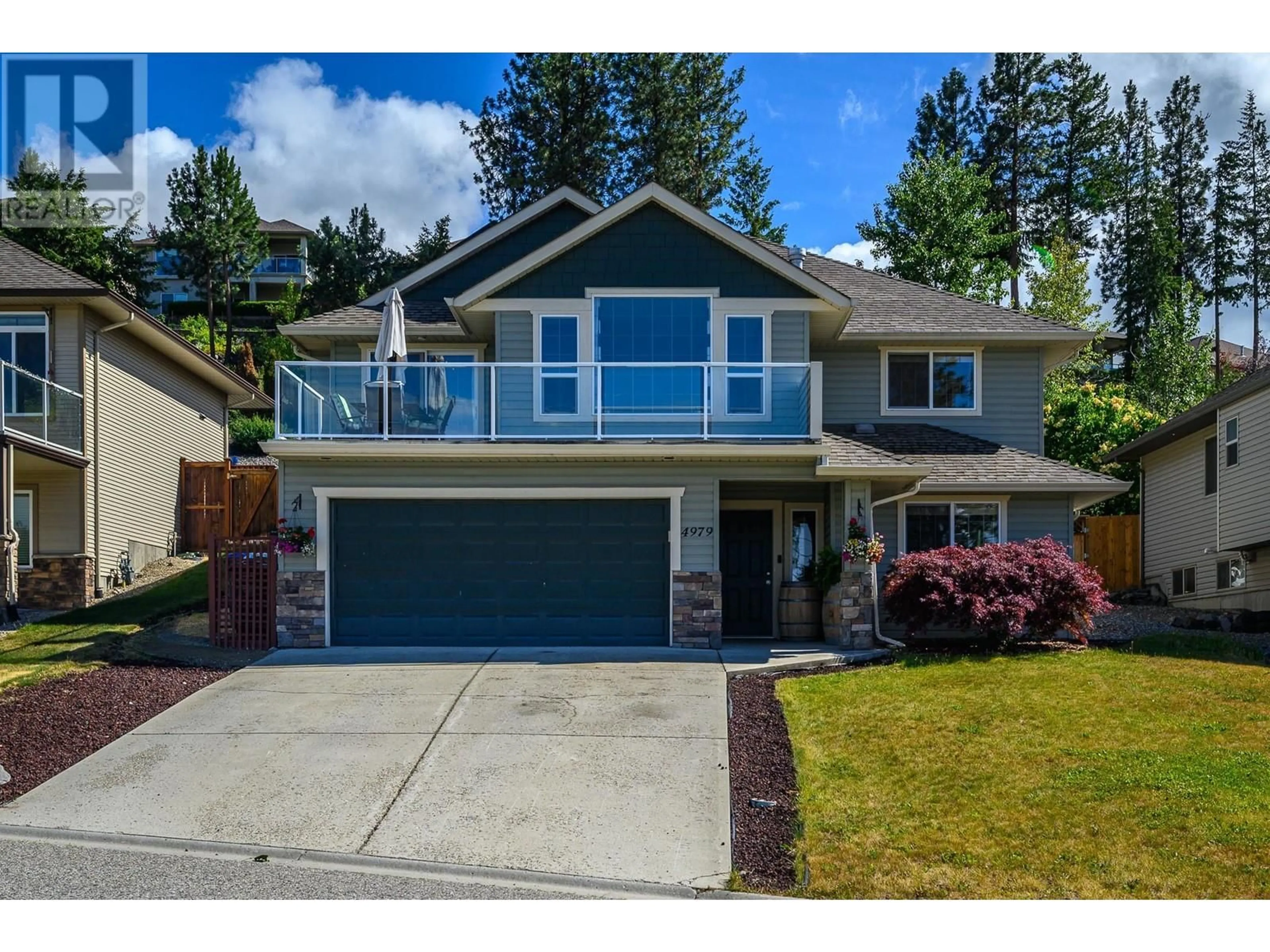 Home with vinyl exterior material, street for 4979 WINDSONG CRESCENT, Kelowna British Columbia V1W5C4