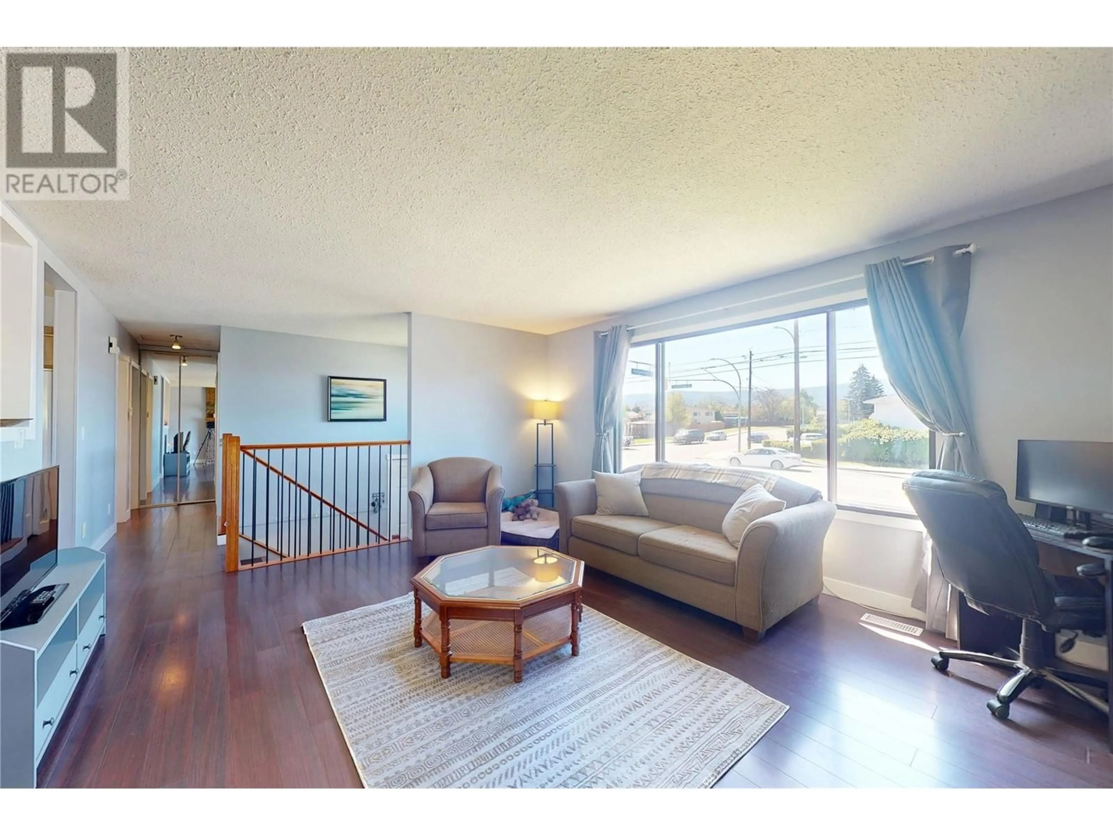 Living room with furniture, wood/laminate floor for 630 LEATHEAD ROAD, Kelowna British Columbia V1X2J6