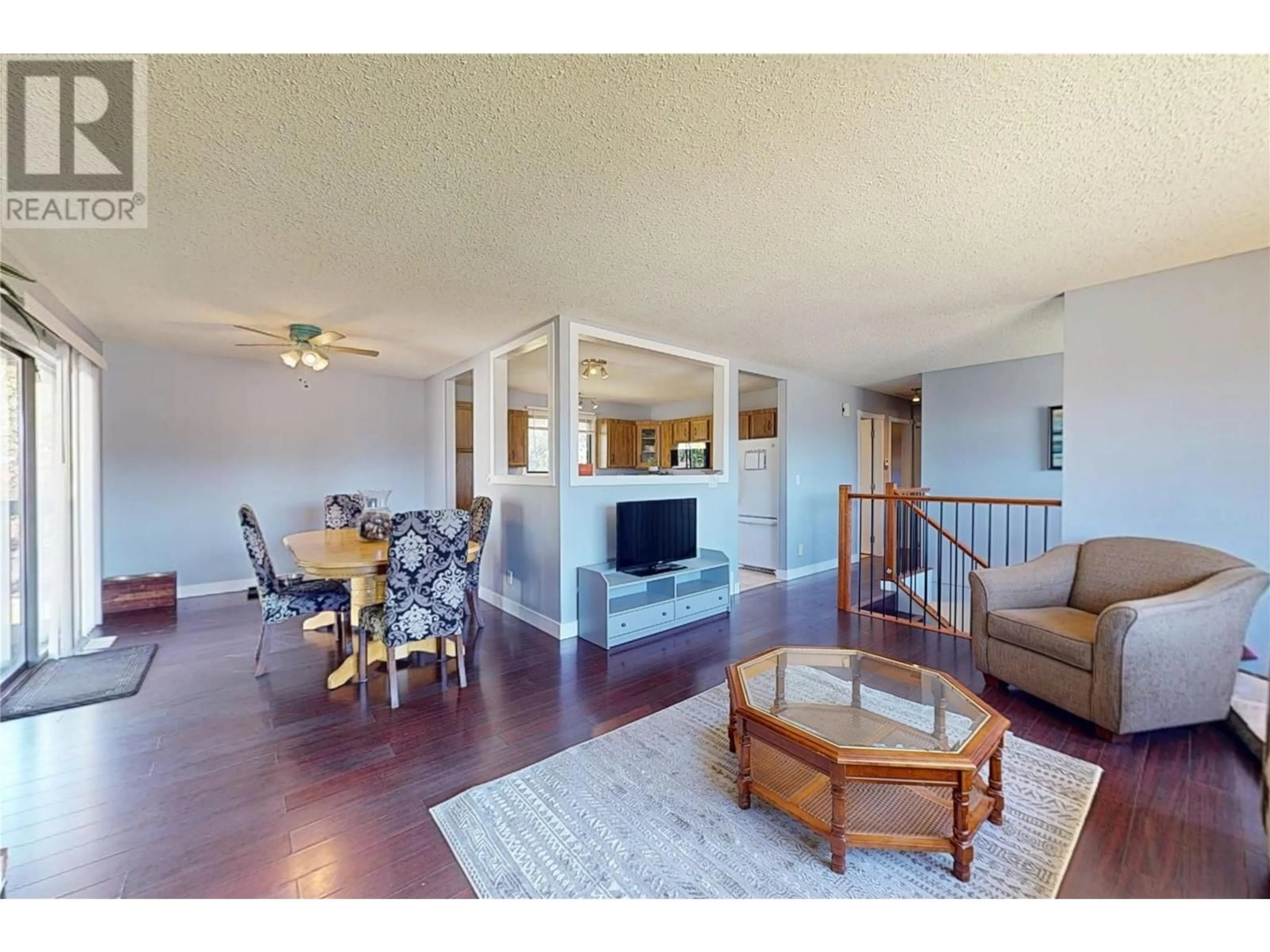 Living room with furniture, wood/laminate floor for 630 LEATHEAD ROAD, Kelowna British Columbia V1X2J6