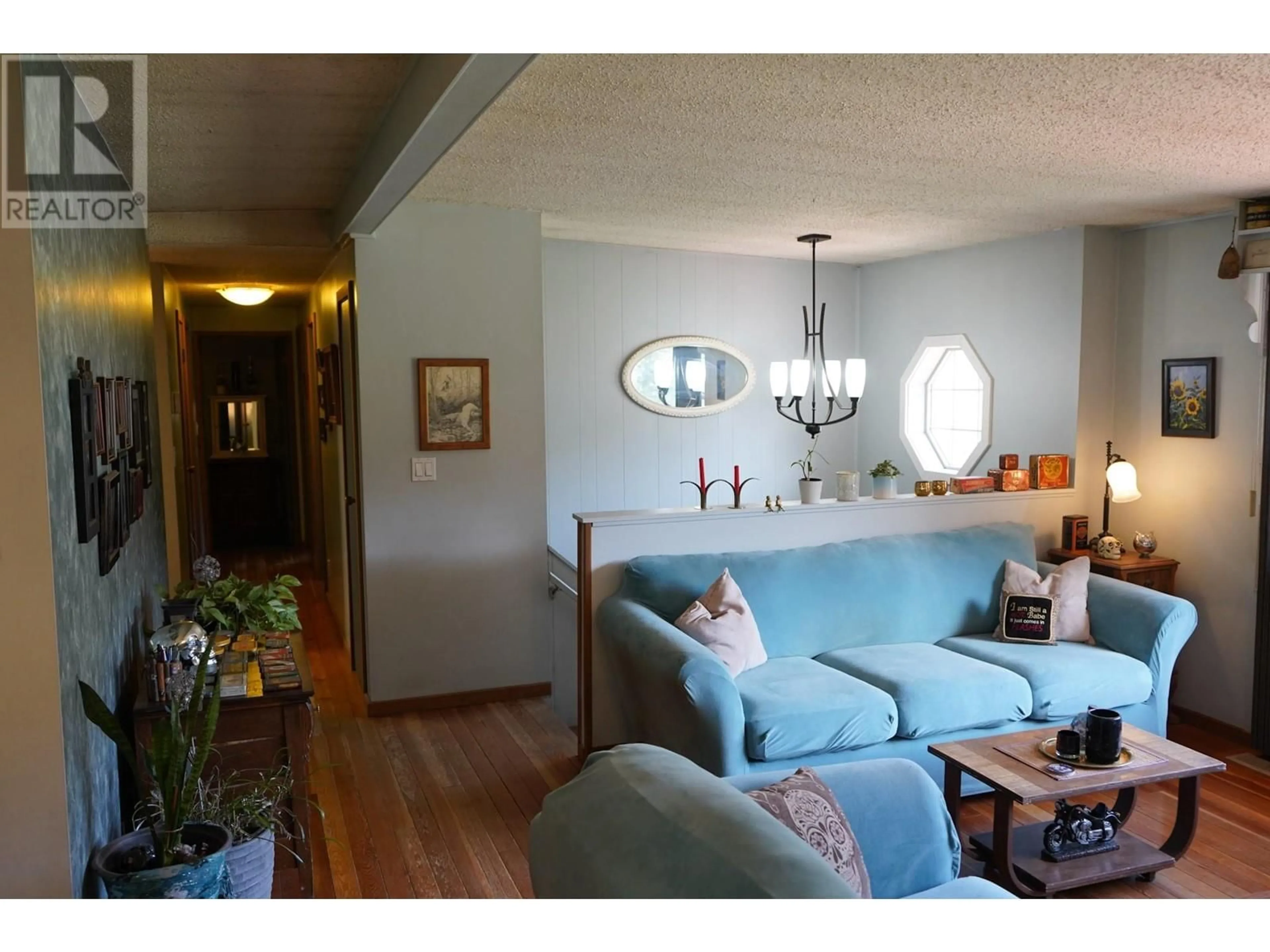 Living room with furniture, wood/laminate floor for 6681 26 MILE FRONTAGE ROAD, Clinton British Columbia V0k1k0