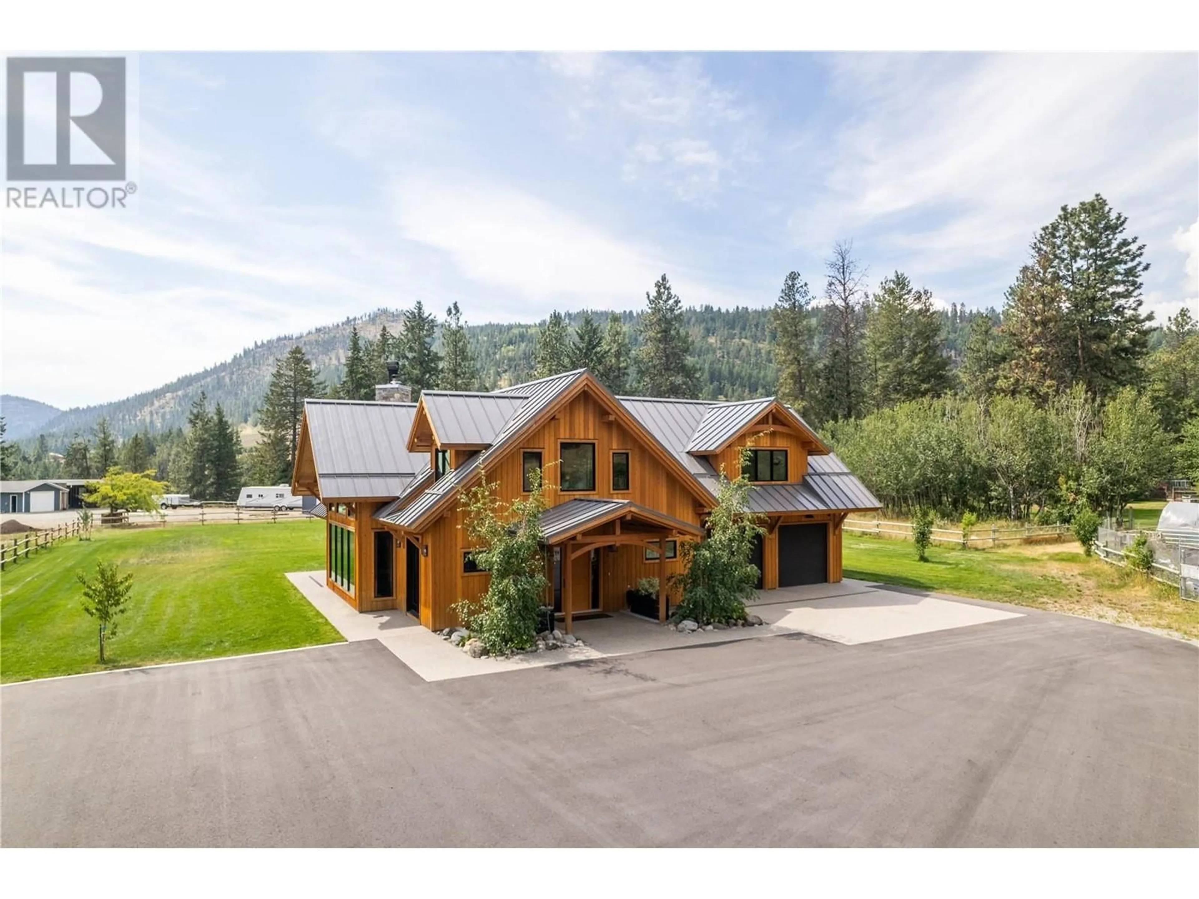 A pic from outside/outdoor area/front of a property/back of a property/a pic from drone, mountain view for 6400 KEYES AVENUE, Peachland British Columbia V0H1X8