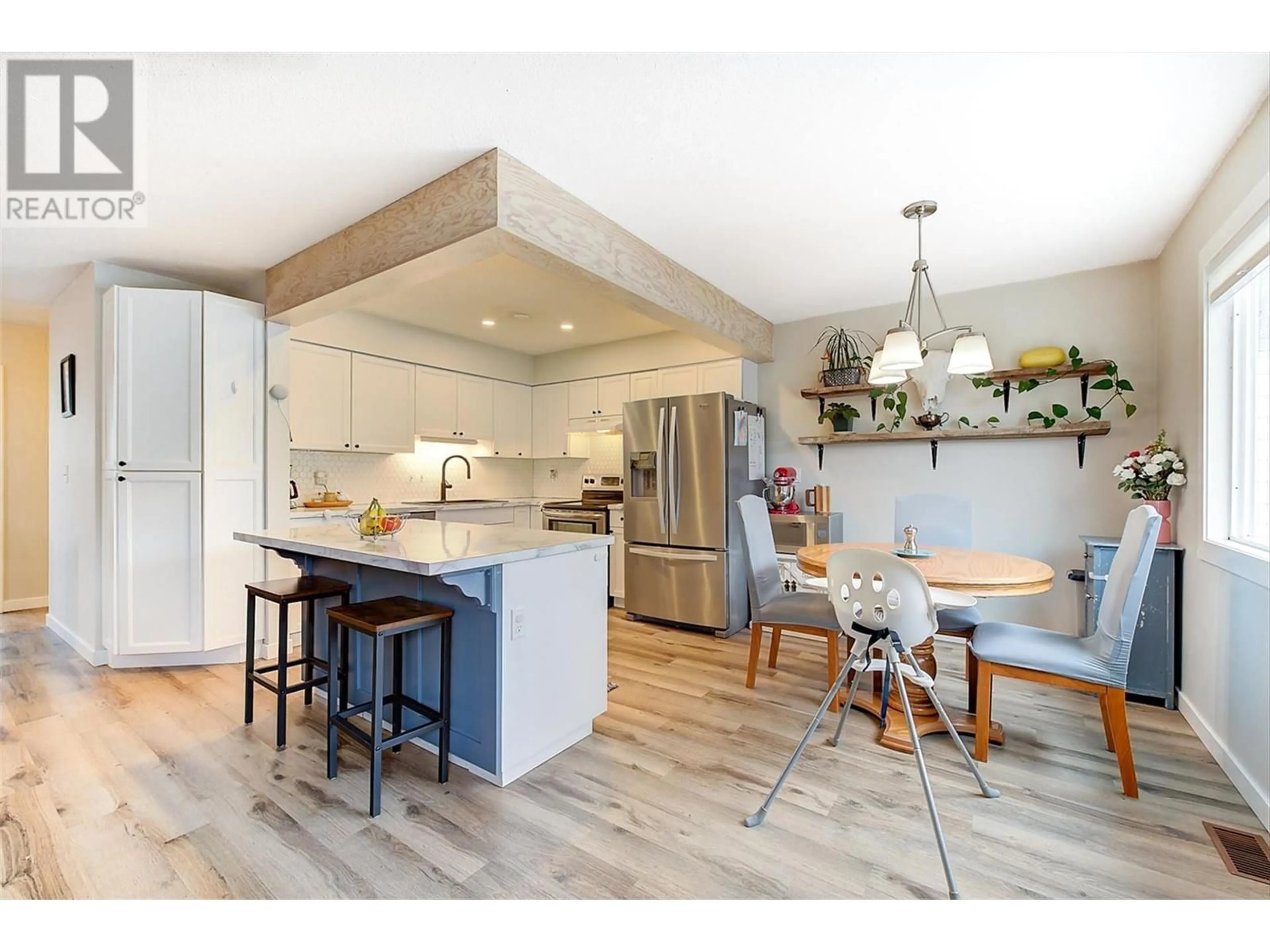 Open concept kitchen, wood/laminate floor for 2937 MCALLISTER ROAD, West Kelowna British Columbia V4T1G8