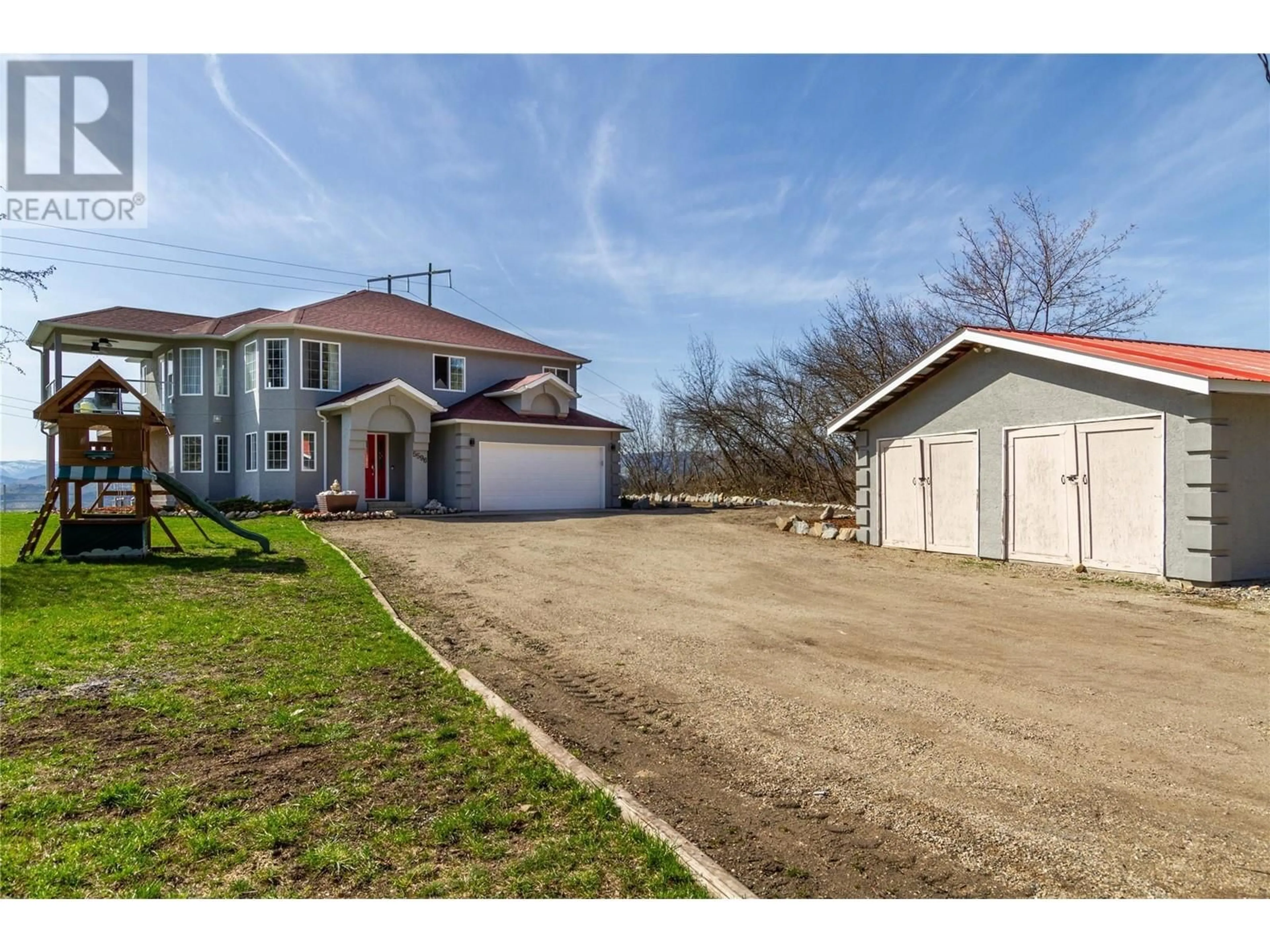 A pic from outside/outdoor area/front of a property/back of a property/a pic from drone, street for 5596 CURLEW ROAD, Vernon British Columbia V1B3J8