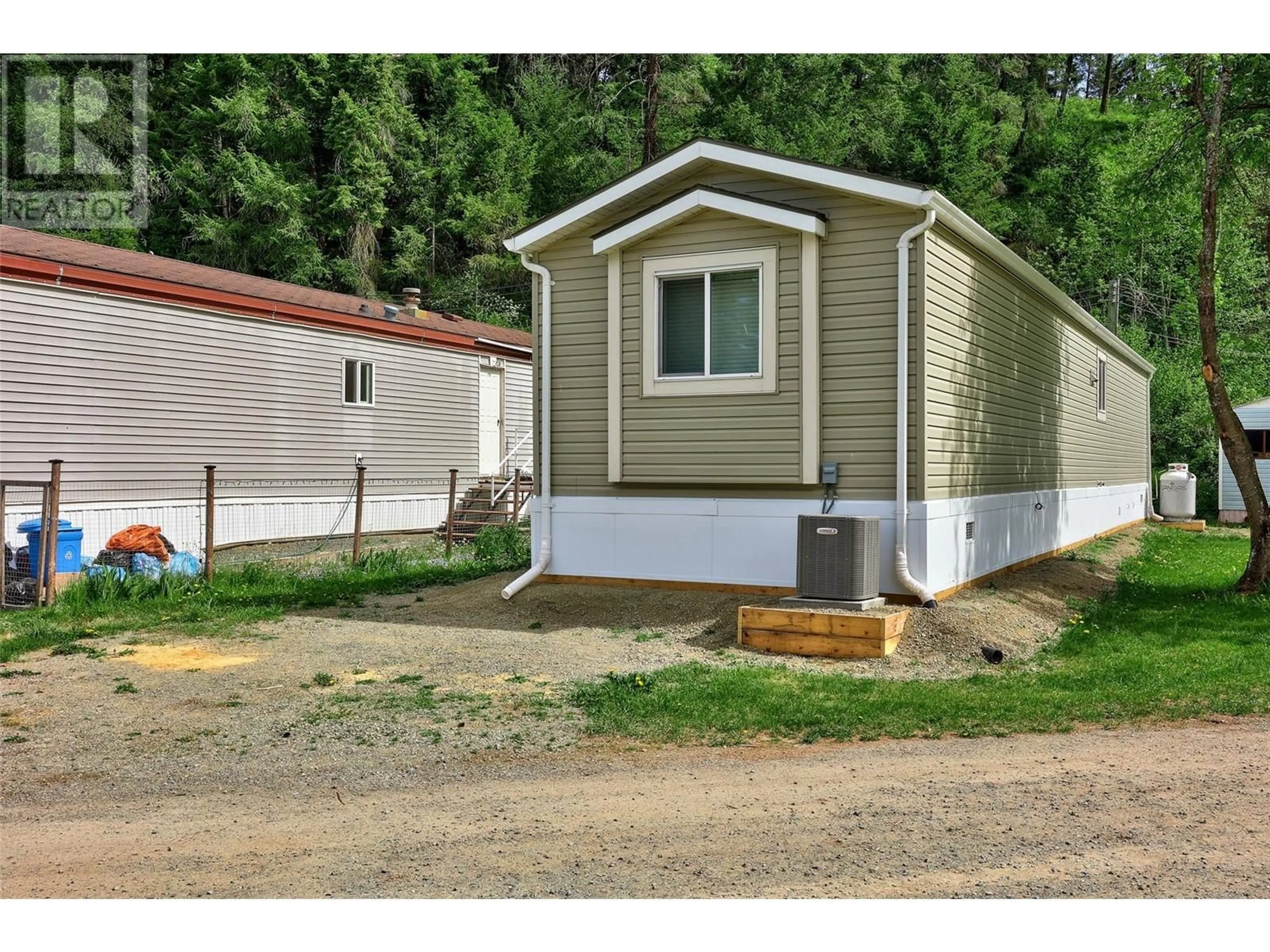 Home with vinyl exterior material, street for 11 - 4428 BARRIERE TOWN ROAD, Barriere British Columbia V0E1E0