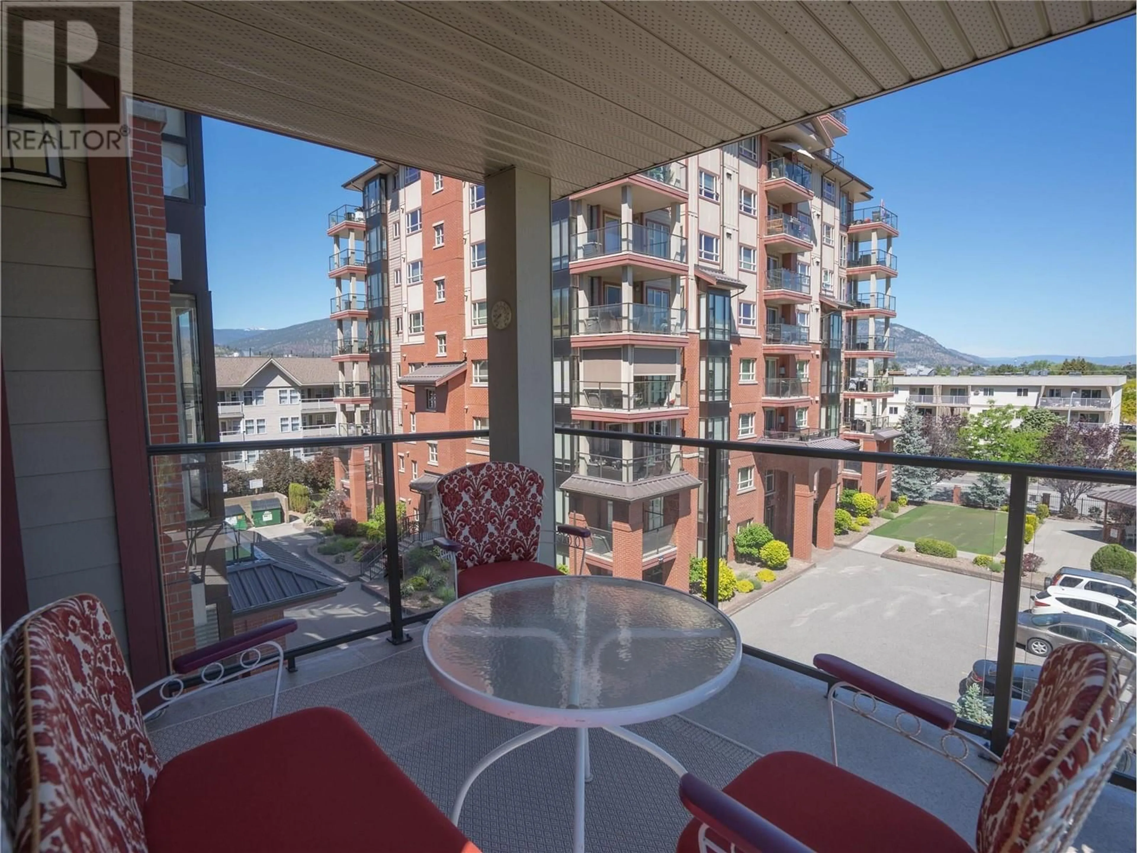 Balcony in the apartment, city buildings view from balcony for 402 - 2125 ATKINSON STREET, Penticton British Columbia V2A9E6