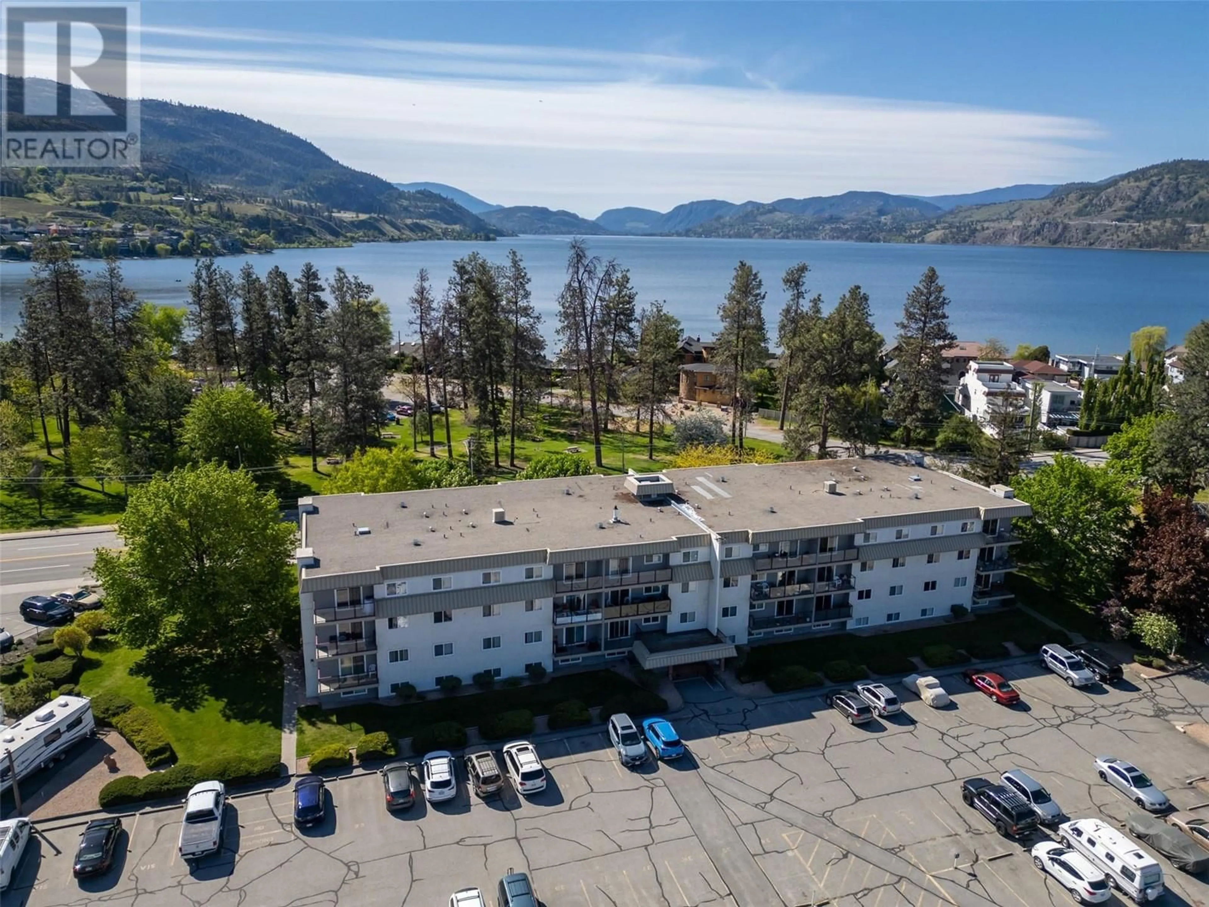 A pic from outside/outdoor area/front of a property/back of a property/a pic from drone, water/lake/river/ocean view for 411 - 110 SKAHA PLACE, Penticton British Columbia V2A7L1