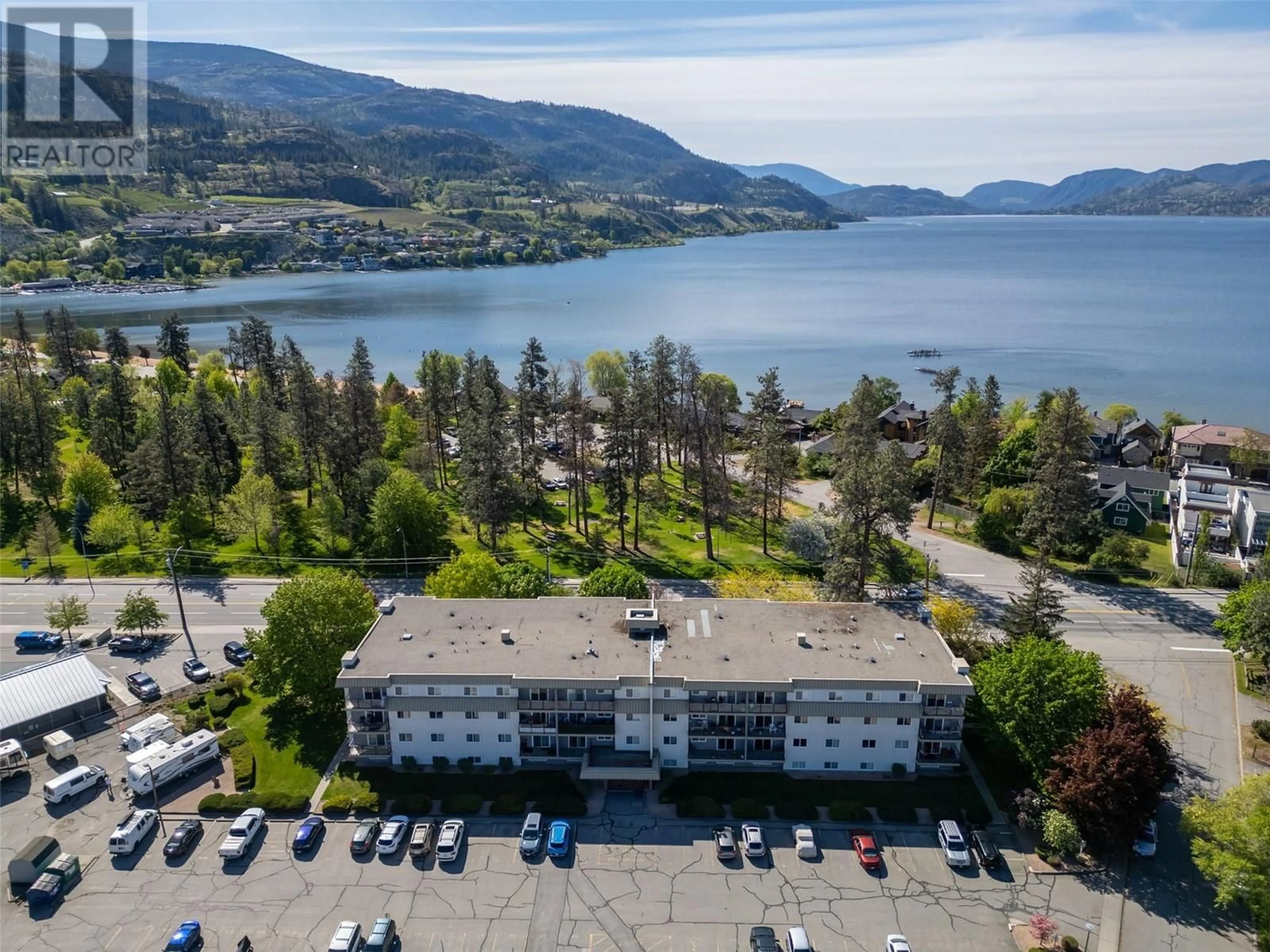 A pic from outside/outdoor area/front of a property/back of a property/a pic from drone, water/lake/river/ocean view for 411 - 110 SKAHA PLACE, Penticton British Columbia V2A7L1