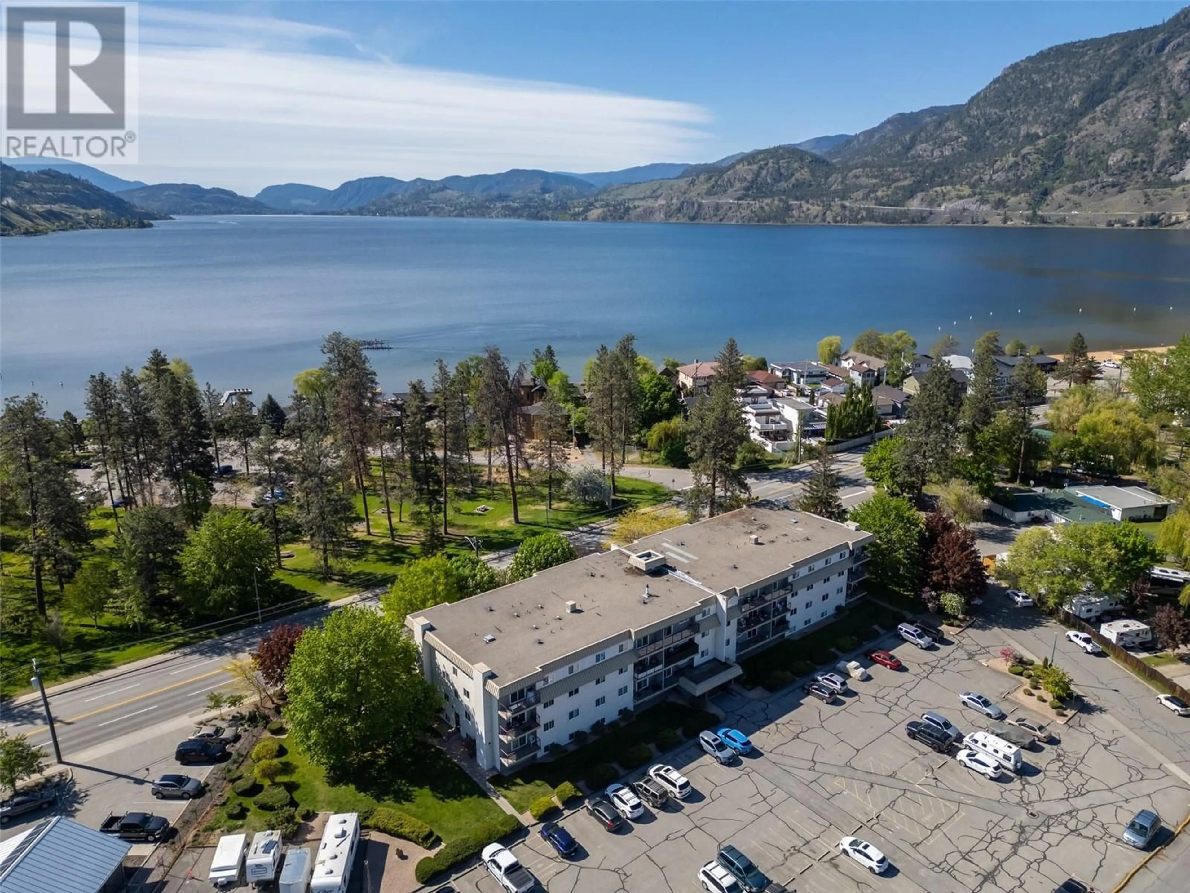 A pic from outside/outdoor area/front of a property/back of a property/a pic from drone, water/lake/river/ocean view for 411 - 110 SKAHA PLACE, Penticton British Columbia V2A7L1