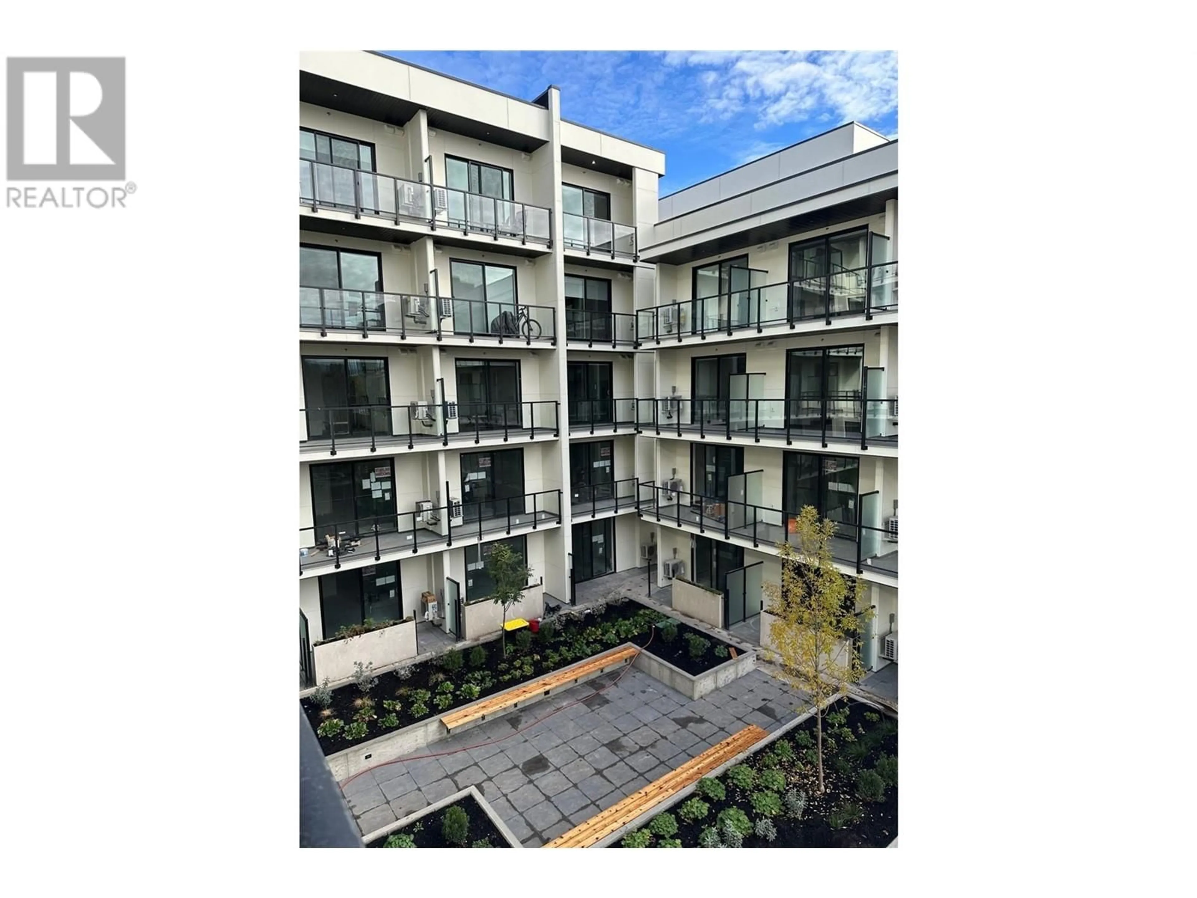 A pic from outside/outdoor area/front of a property/back of a property/a pic from drone, building for 443 - 1274 DEVONSHIRE AVENUE, Kelowna British Columbia V1Y0M7