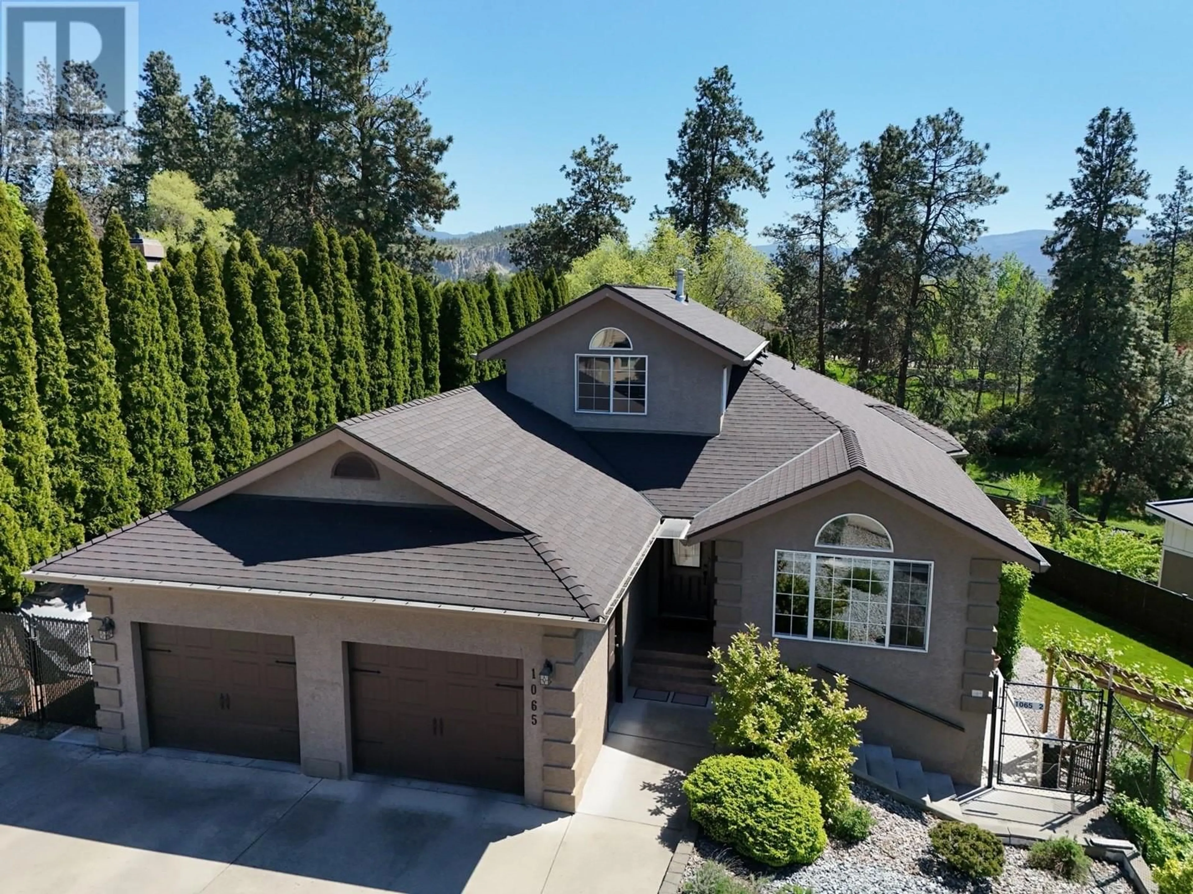 A pic from outside/outdoor area/front of a property/back of a property/a pic from drone, mountain view for 1065 WALDIE COURT, Kelowna British Columbia V1Y9P8
