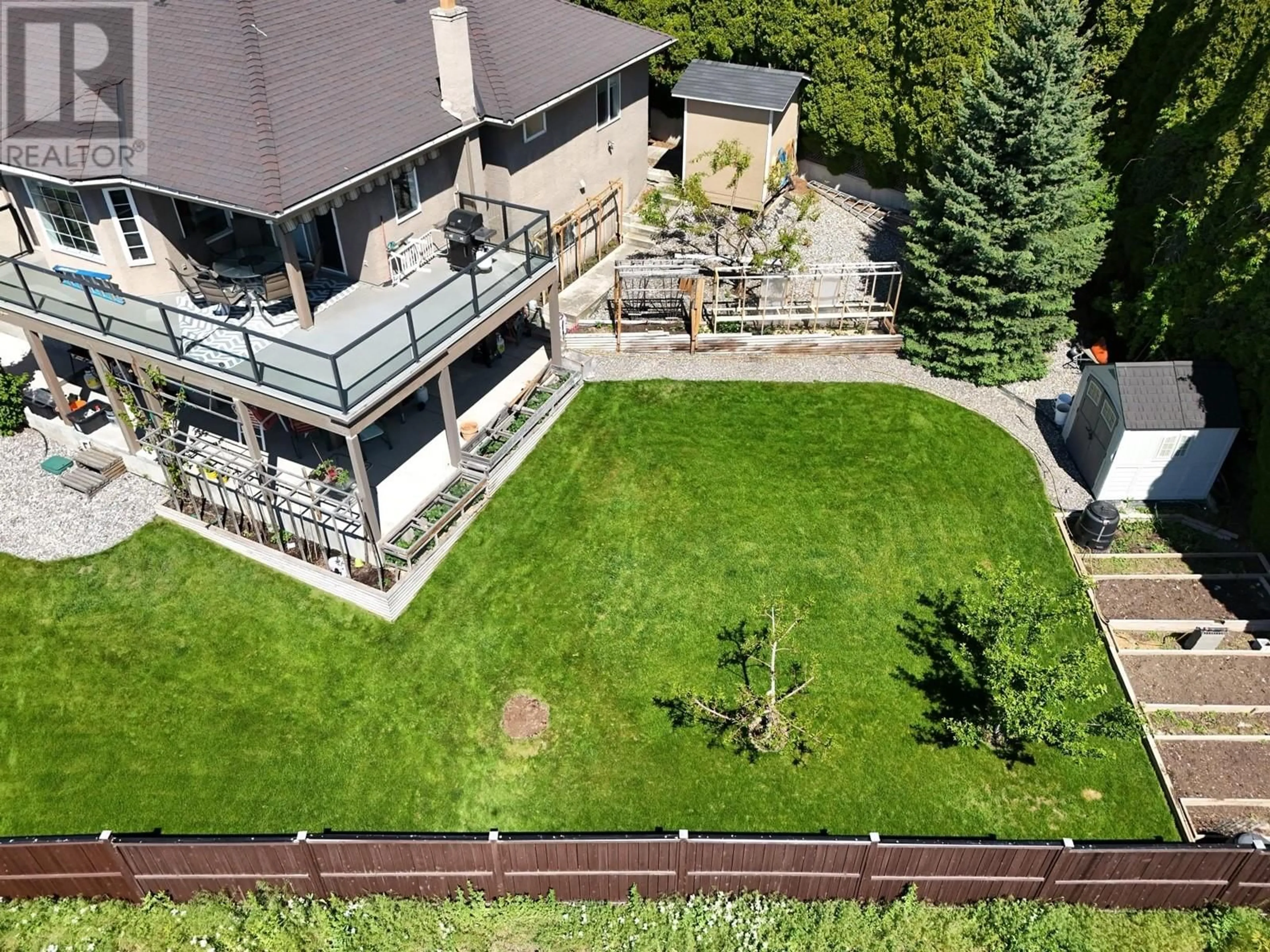 A pic from outside/outdoor area/front of a property/back of a property/a pic from drone, mountain view for 1065 WALDIE COURT, Kelowna British Columbia V1Y9P8