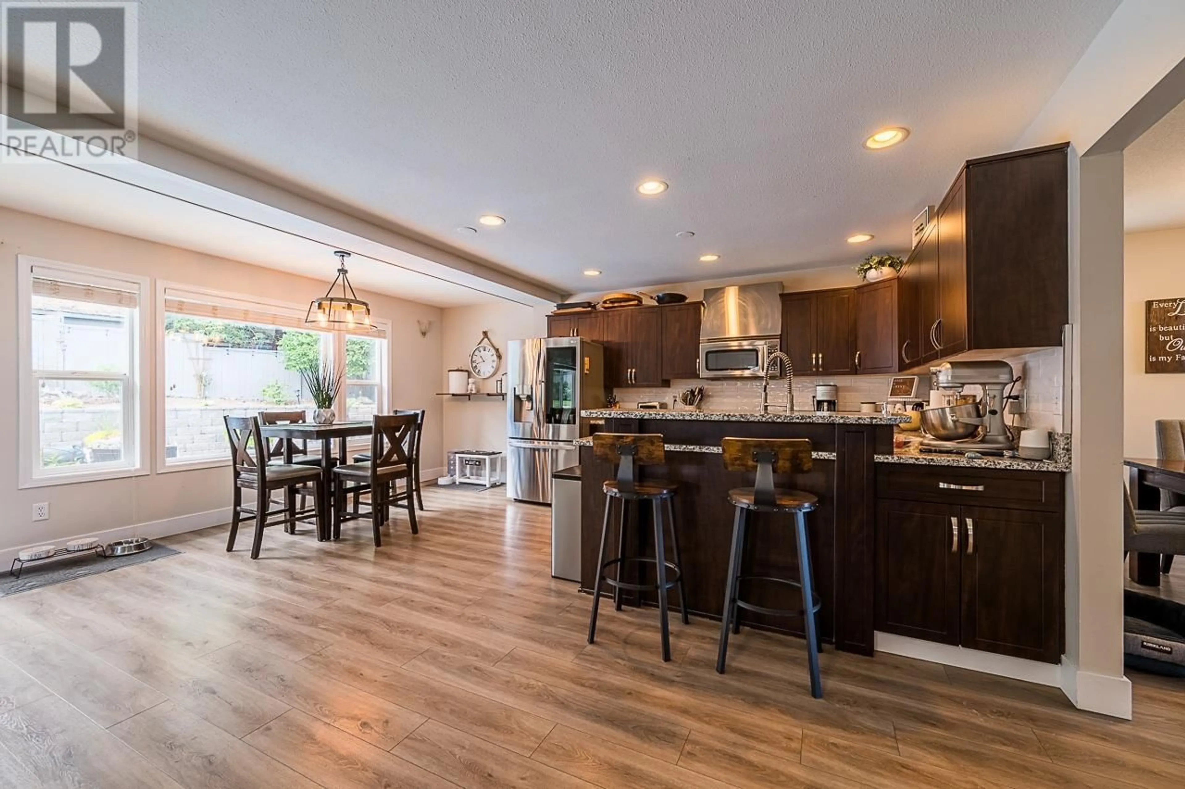 Open concept kitchen, wood/laminate floor for 927 HEATHERTON COURT, Kamloops British Columbia V2H1T7