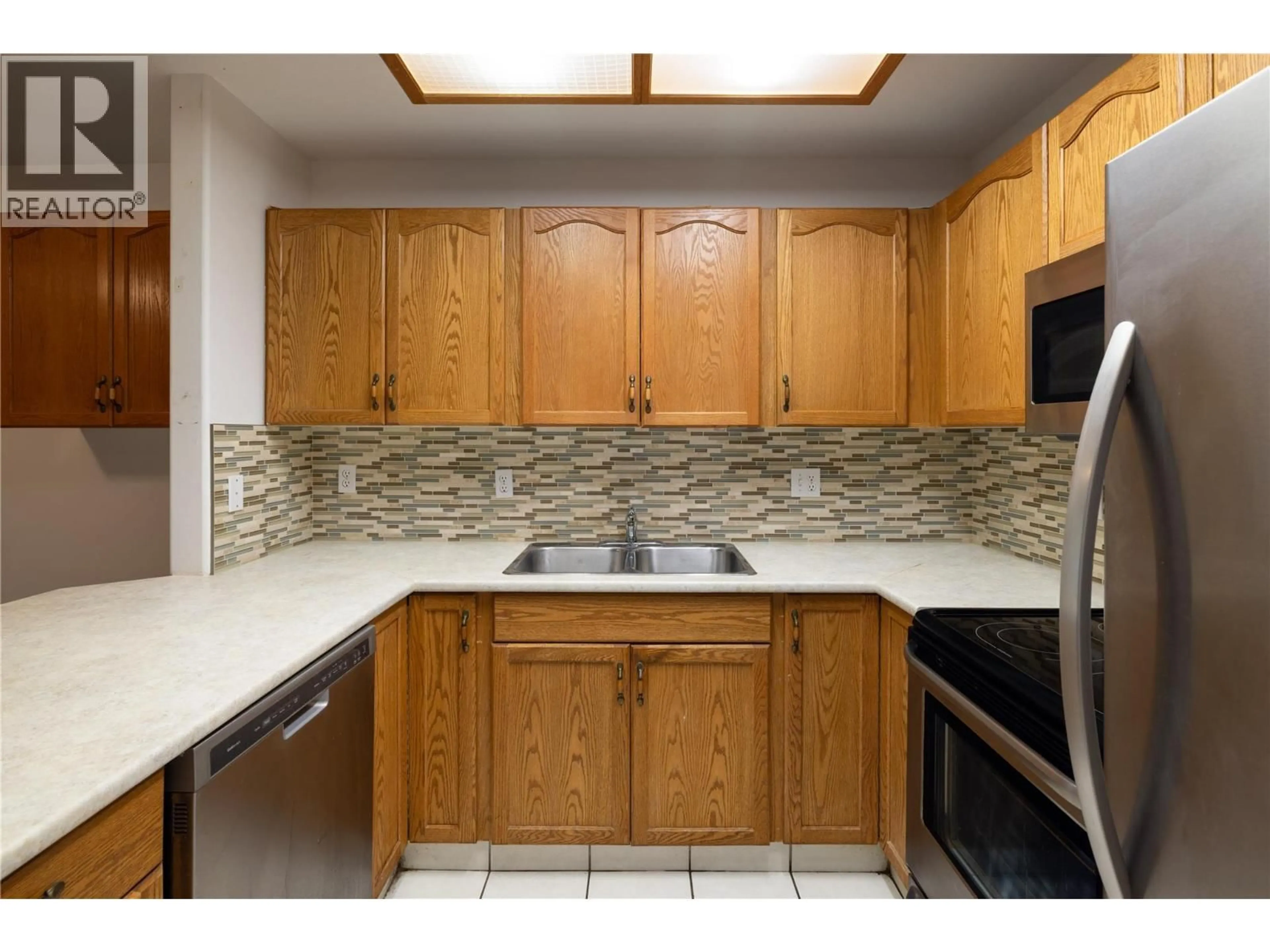 Standard kitchen, ceramic/tile floor for 308 - 3310 SKAHA LAKE ROAD, Penticton British Columbia V2A6G4