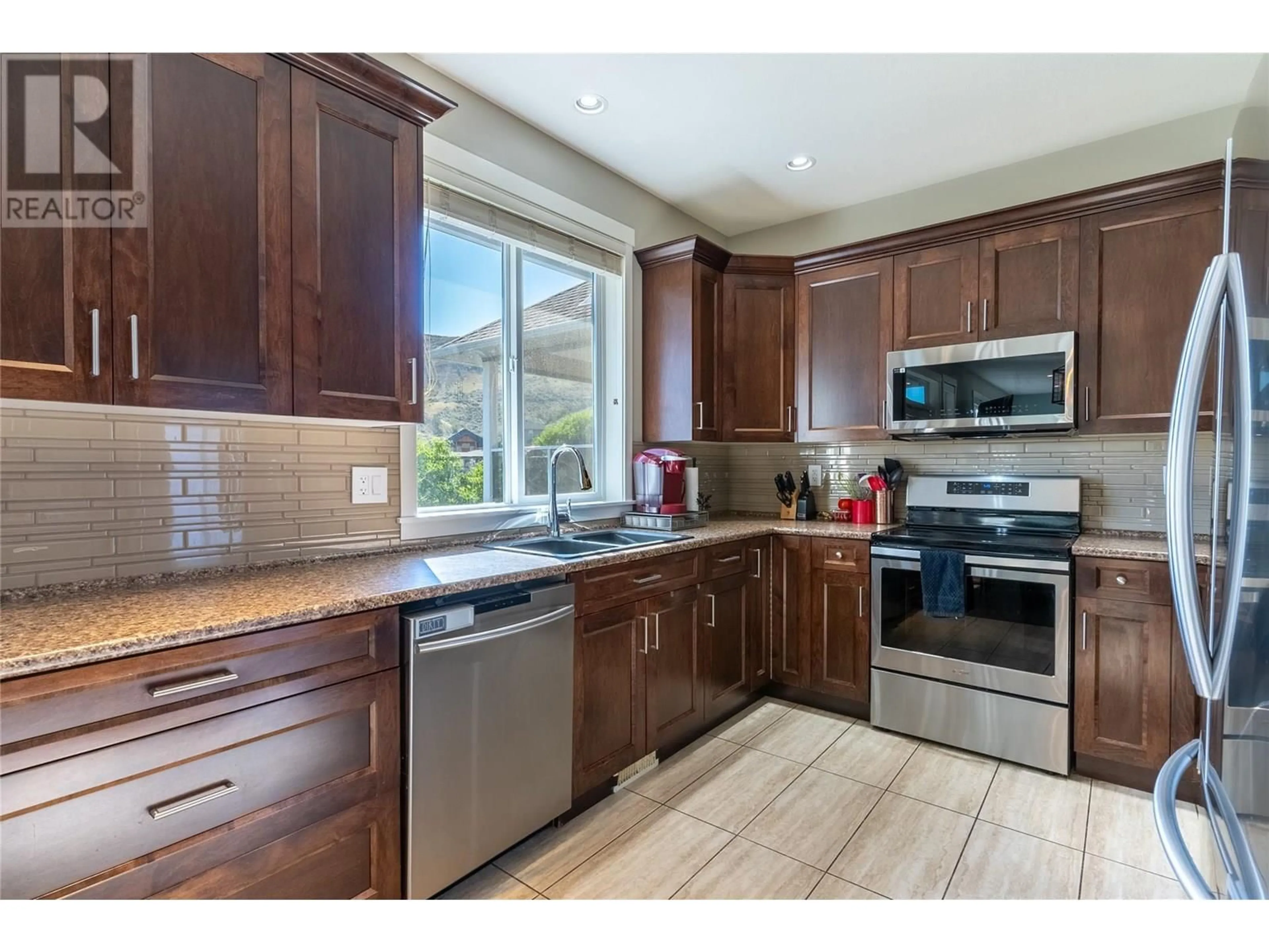 Open concept kitchen, ceramic/tile floor for 1041 SADDLEBACK COURT, Kamloops British Columbia V2B0B9