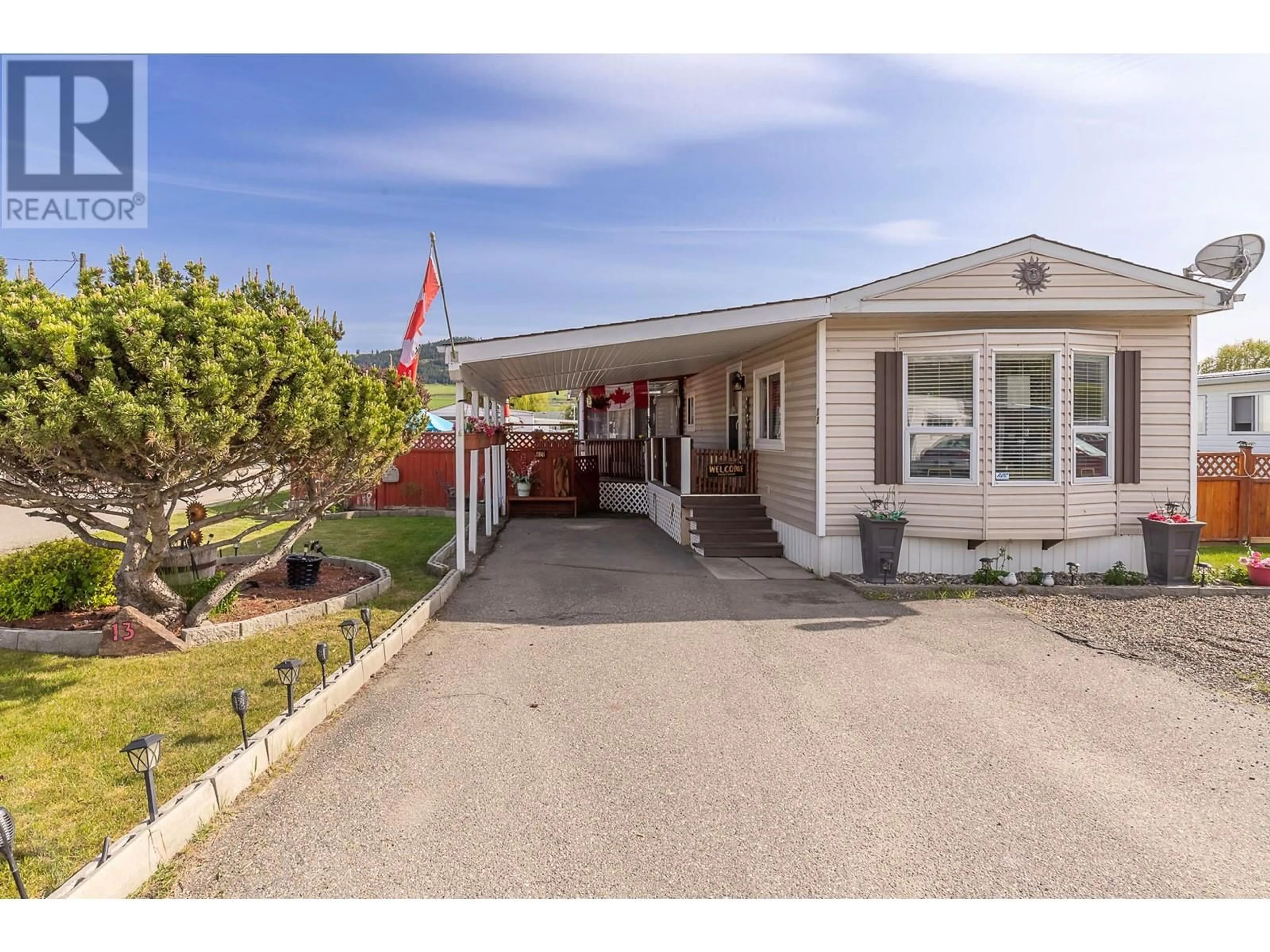 Home with vinyl exterior material, street for 13 - 2727 LAKESHORE ROAD, Vernon British Columbia V1H1X5