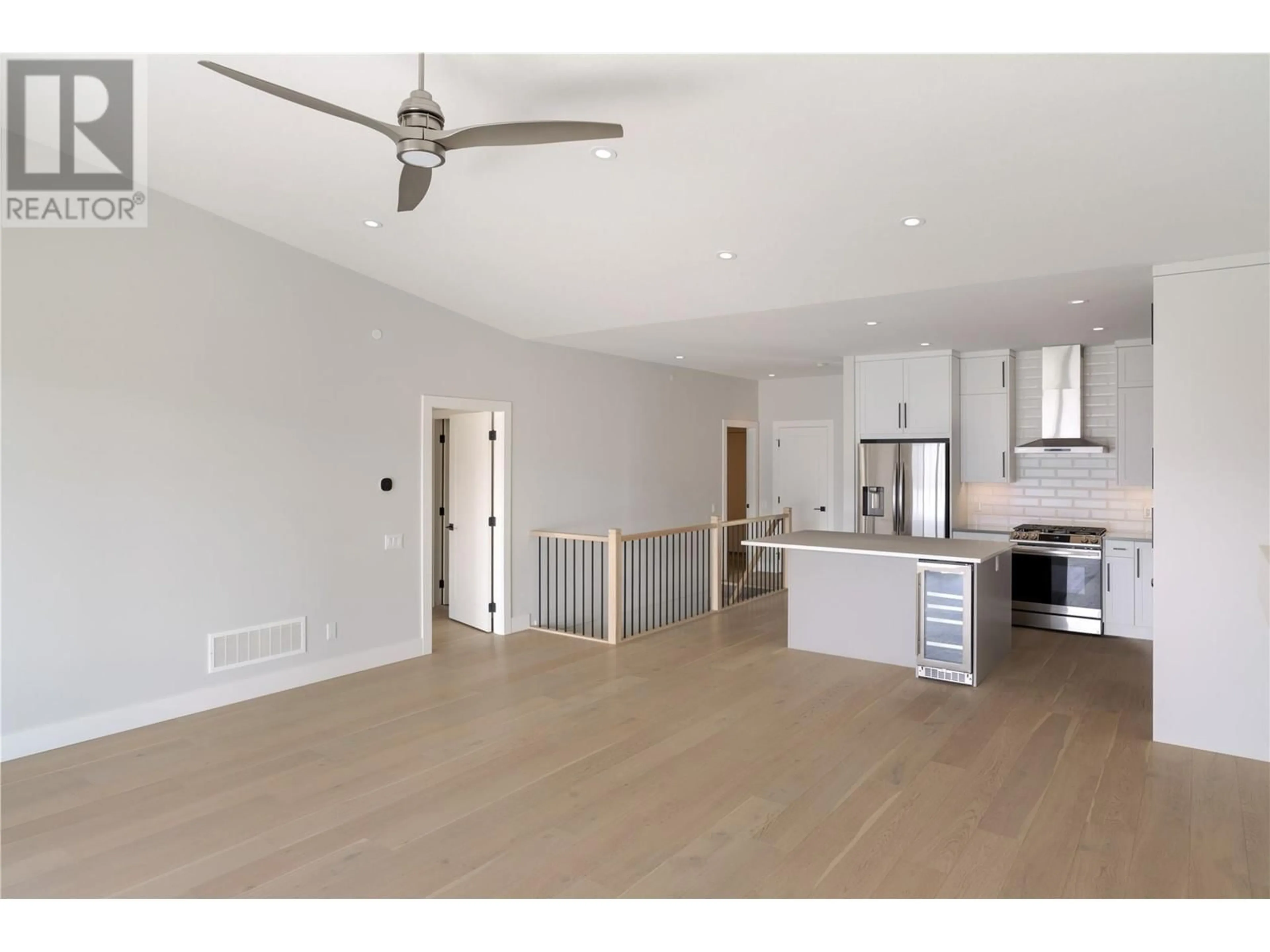 Open concept kitchen, wood/laminate floor for 3 - 10100 TYNDALL ROAD, Lake Country British Columbia V4V0A9