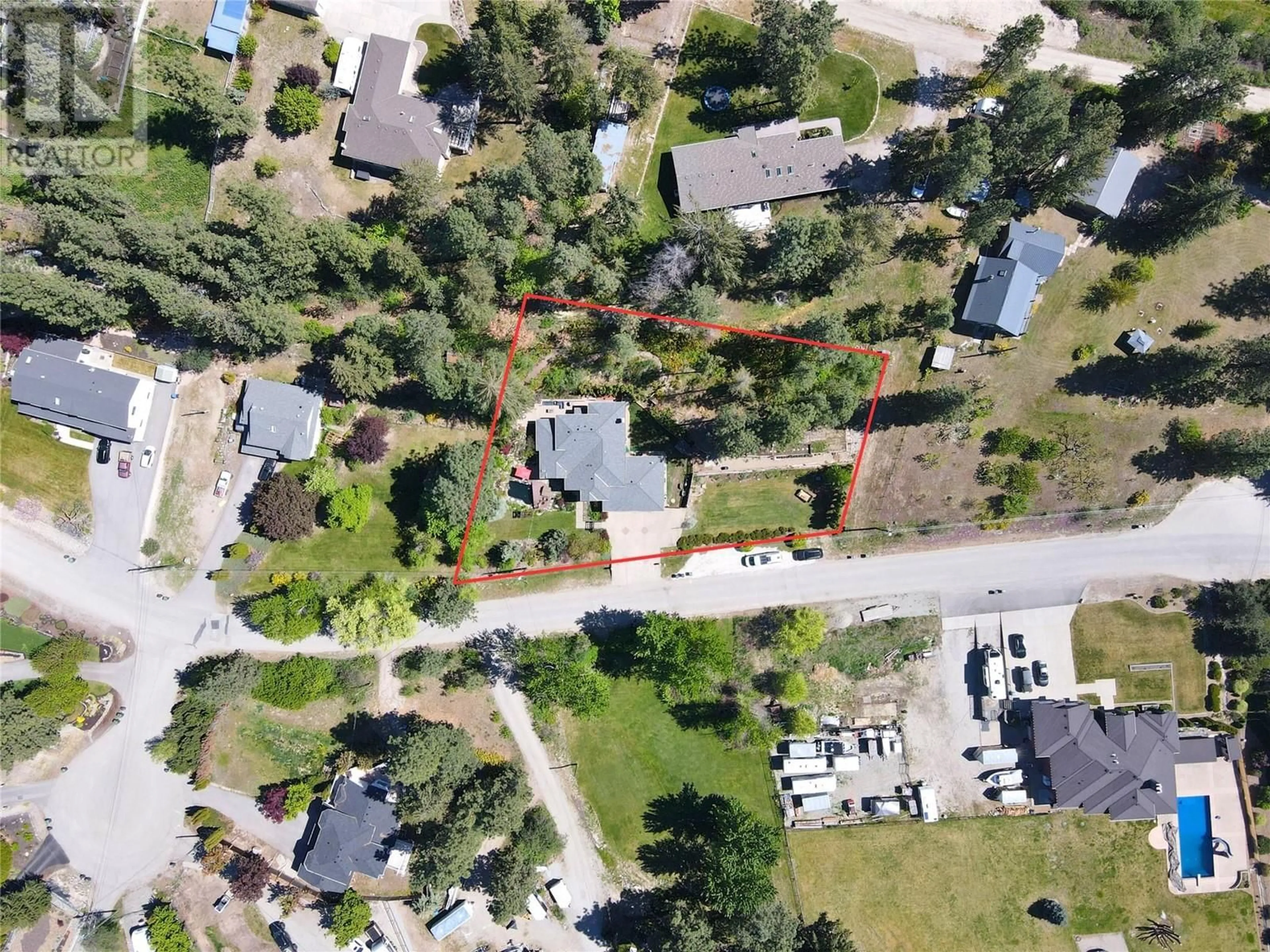 A pic from outside/outdoor area/front of a property/back of a property/a pic from drone, street for 10839 HALLAM DRIVE, Lake Country British Columbia V4V1P1