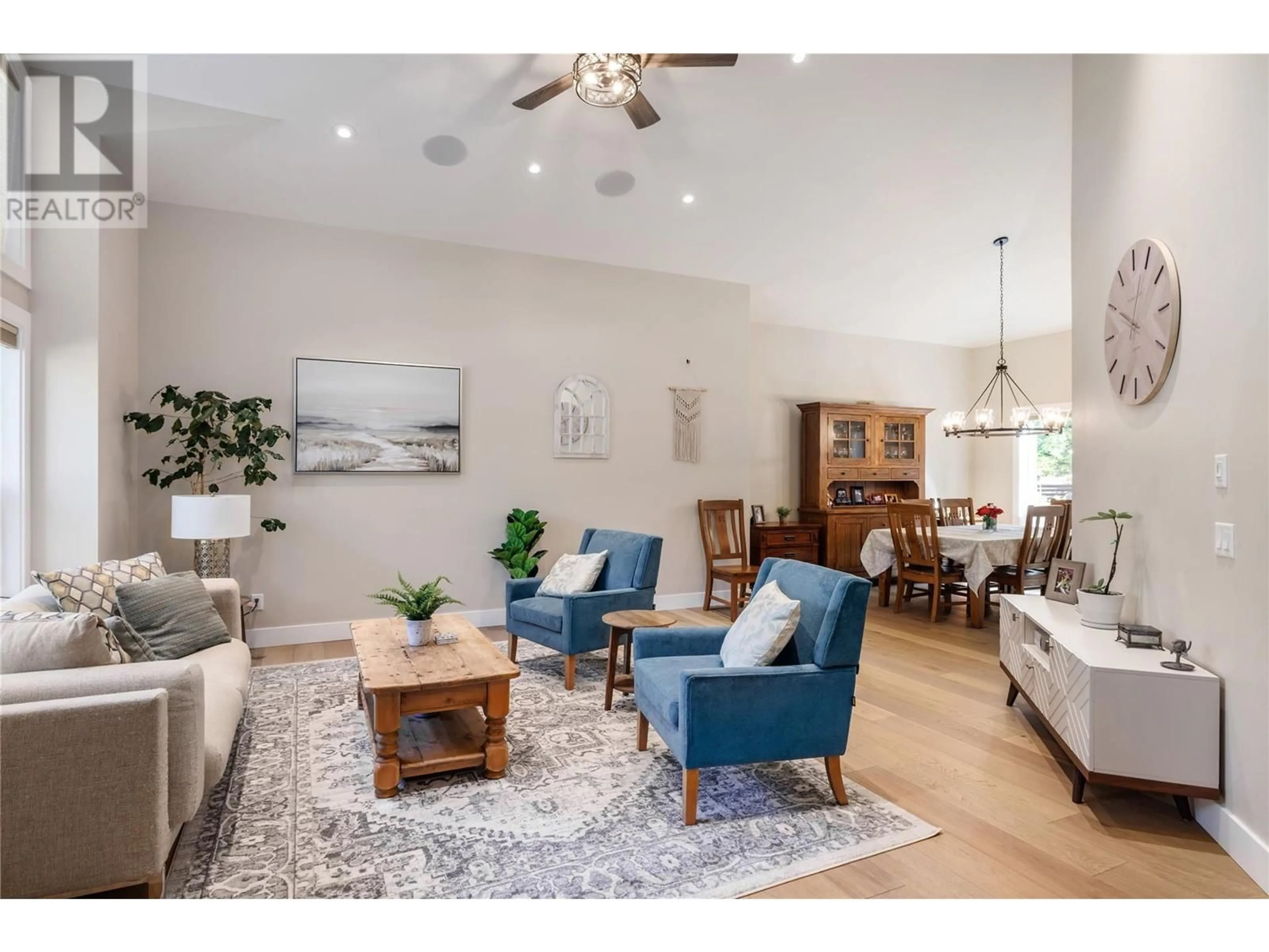Living room with furniture, wood/laminate floor for 10839 HALLAM DRIVE, Lake Country British Columbia V4V1P1