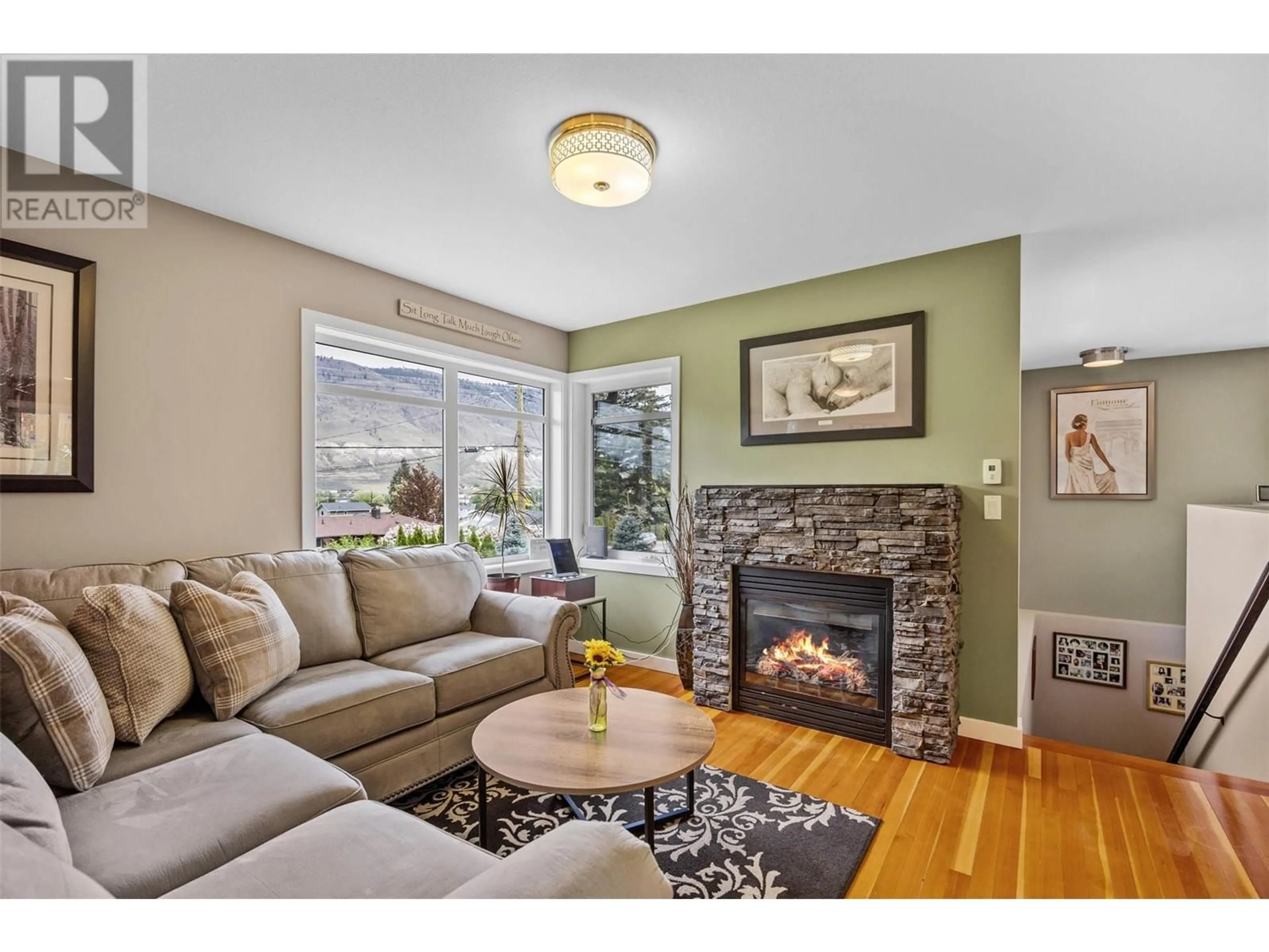 Living room with furniture, wood/laminate floor for 2015 VALLEYVIEW DRIVE, Kamloops British Columbia V2C4C3