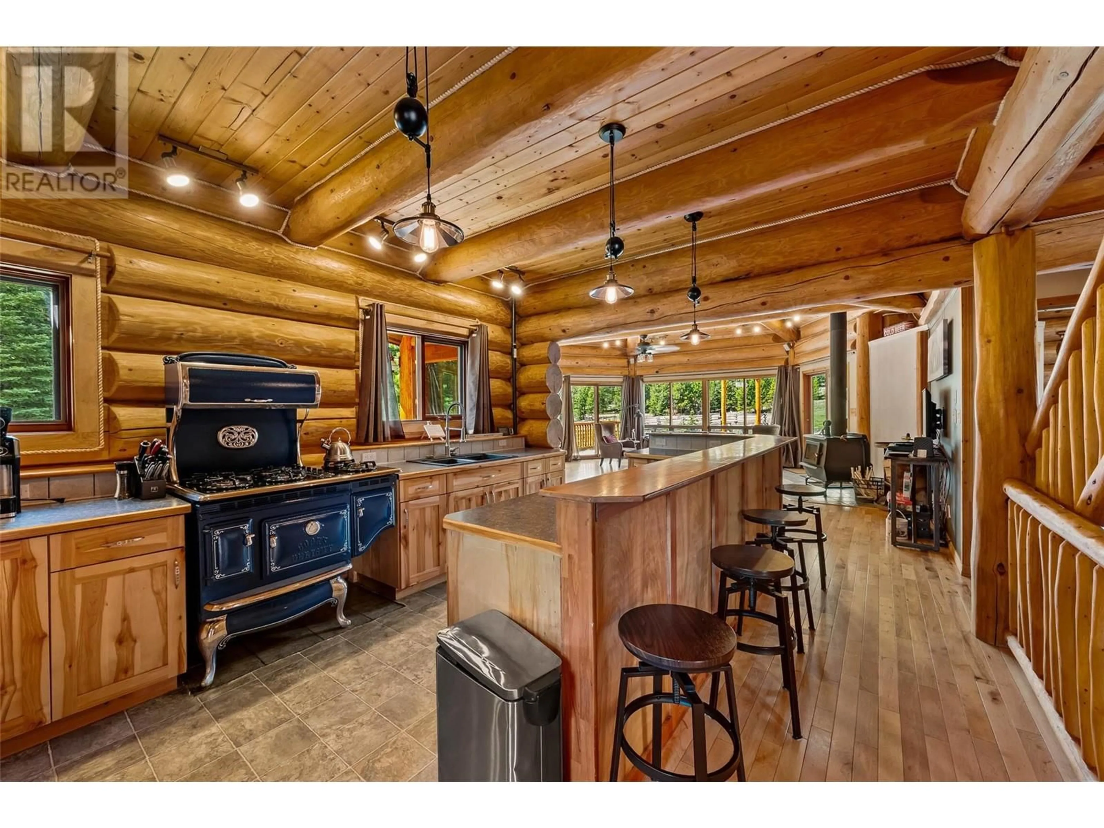 Rustic kitchen, wood/laminate floor for 4890 PINE RIDGE WAY, Logan Lake British Columbia V0K1W0