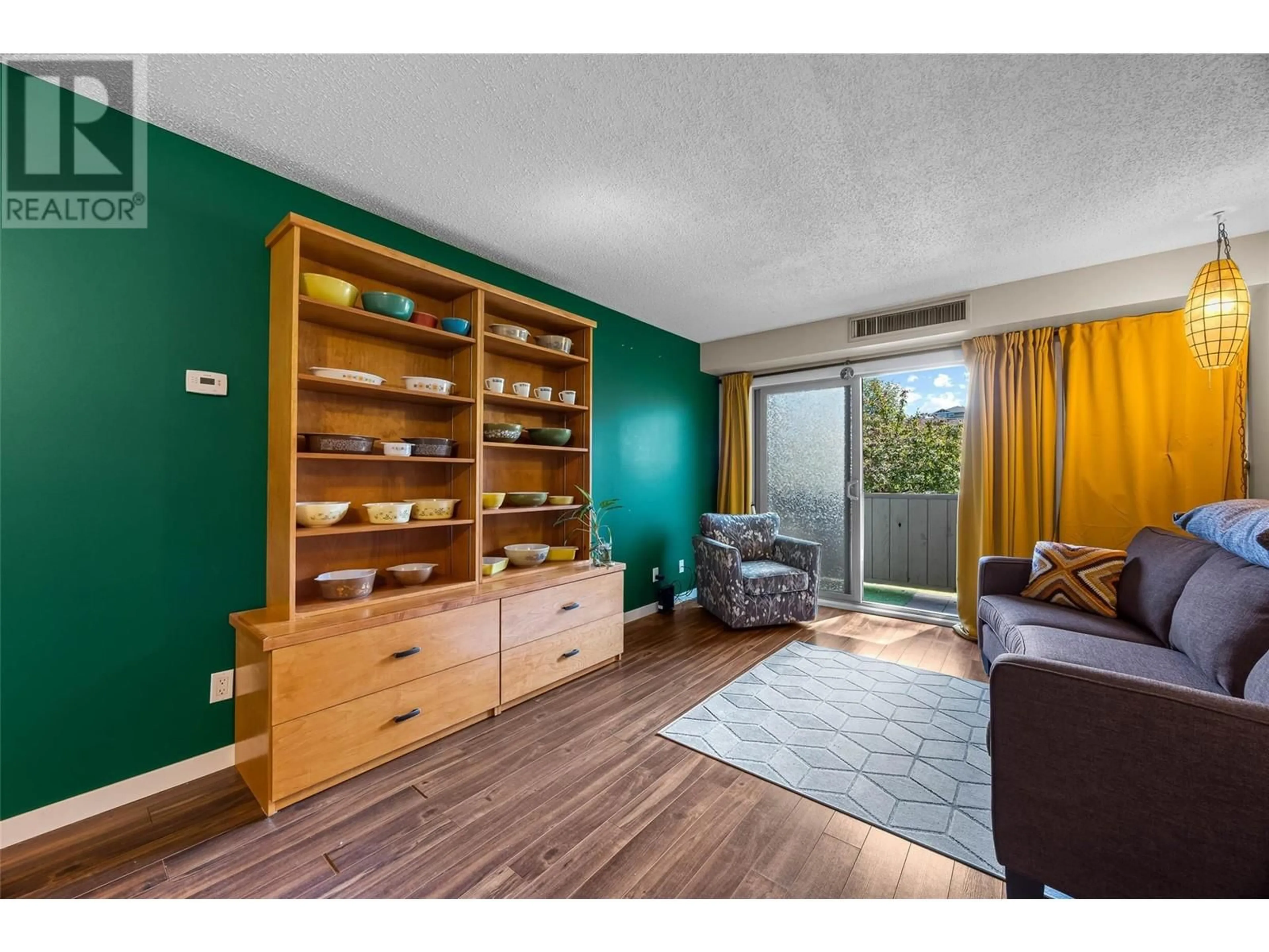 Living room with furniture, wood/laminate floor for 223 - 245 GORDONHORN CRESCENT, Kamloops British Columbia V2E1G5